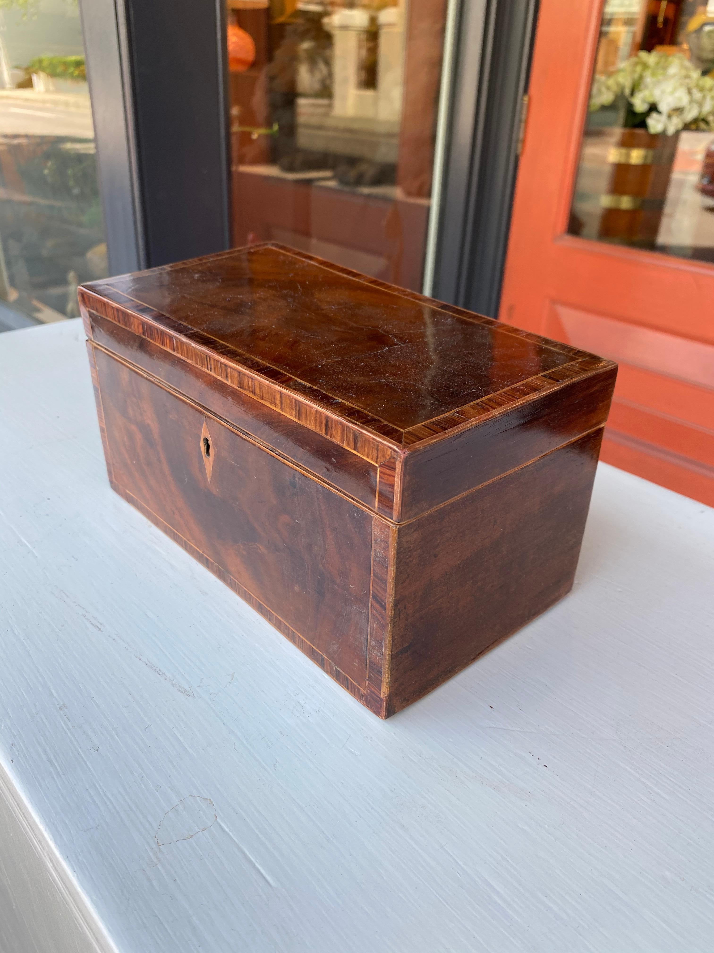 Mahogany inlaid 19th century tea caddy.