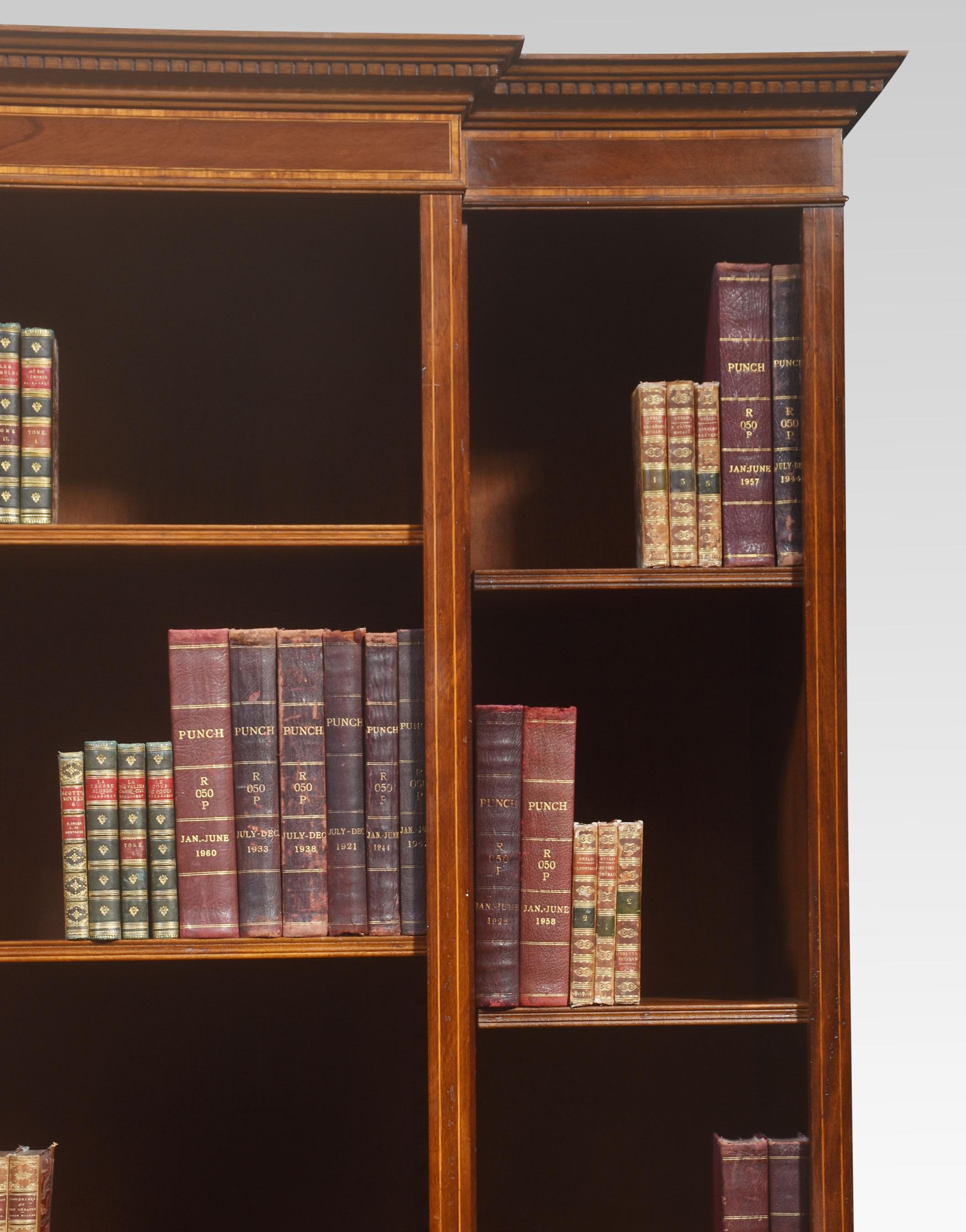 Mahogany inlaid bookcase, the large rectangular breakfront top above an arrangement of adjustable shelves. All raised up on a plinth base.
Dimensions
Height 84.5 Inches
Width 63 Inches
Depth 23 Inches