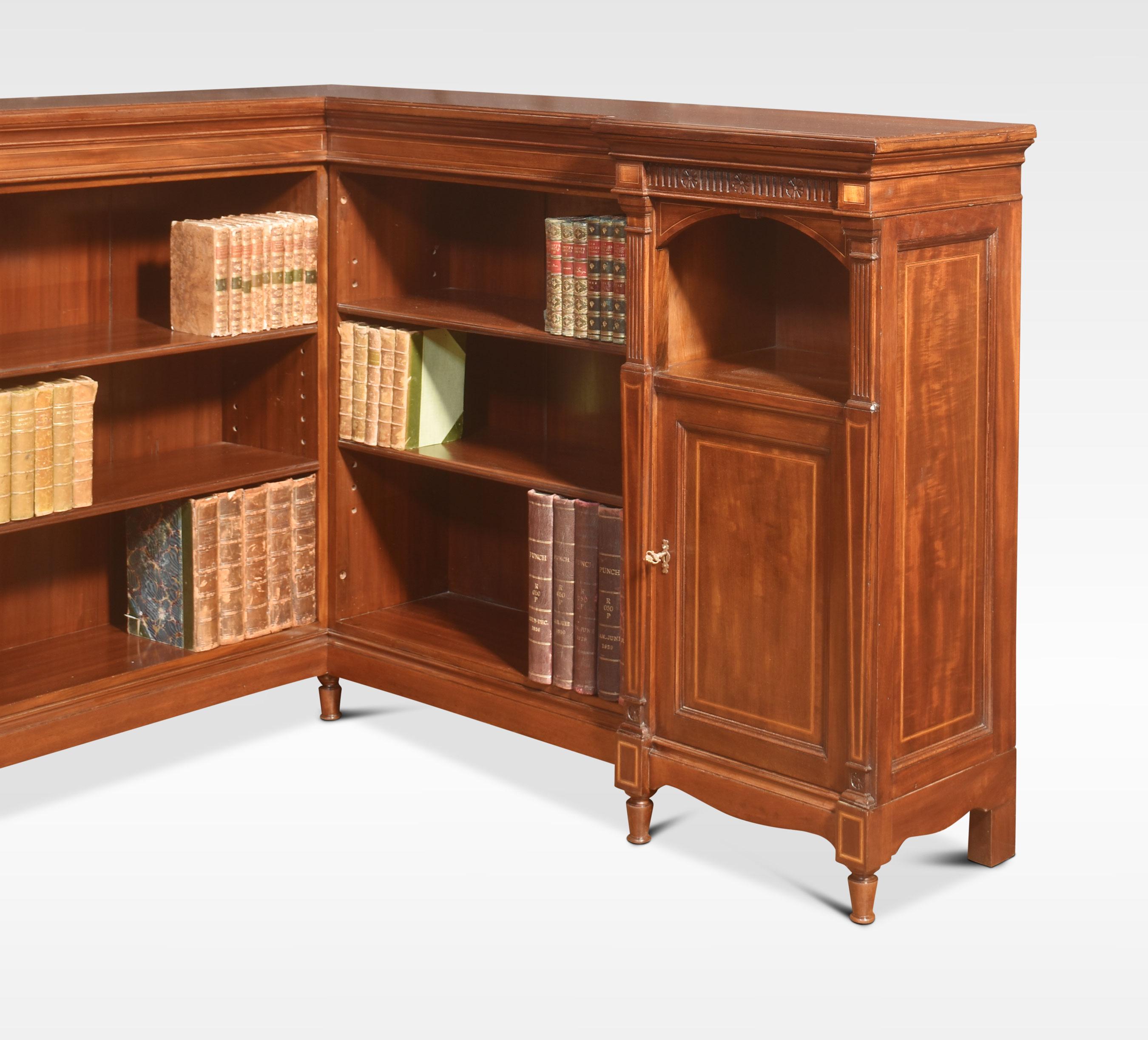 Mahogany inlaid corner bookcase. The well-figured large rectangular lipped top above carved freeze, to the adjustable shelves. Flanked by cupboard ends, all raised up on shaped apron and turned feet. (depth of top 15 Inches)
Dimensions
Height 41