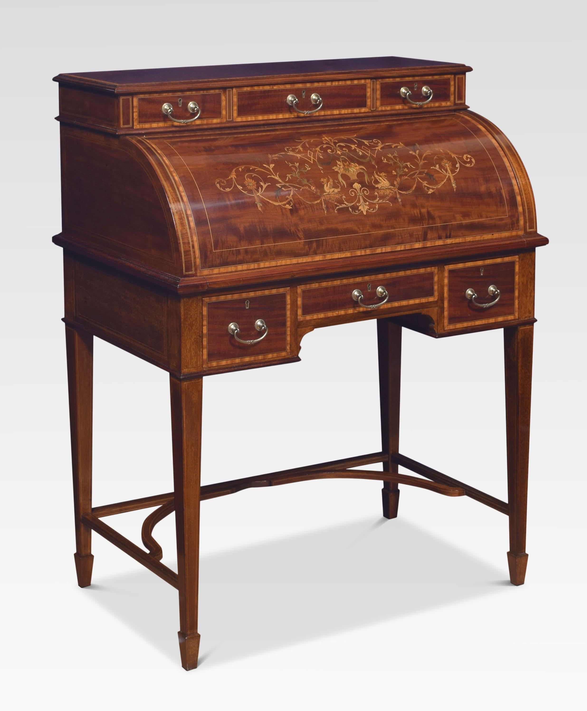 Mahogany cylinder desk, the rectangular top section with satinwood edge over an inlaid fall enclosing a leather-lined writing slide and fitted interior and a further frieze drawer below, raised on square tapered legs.
Dimensions
Height 41