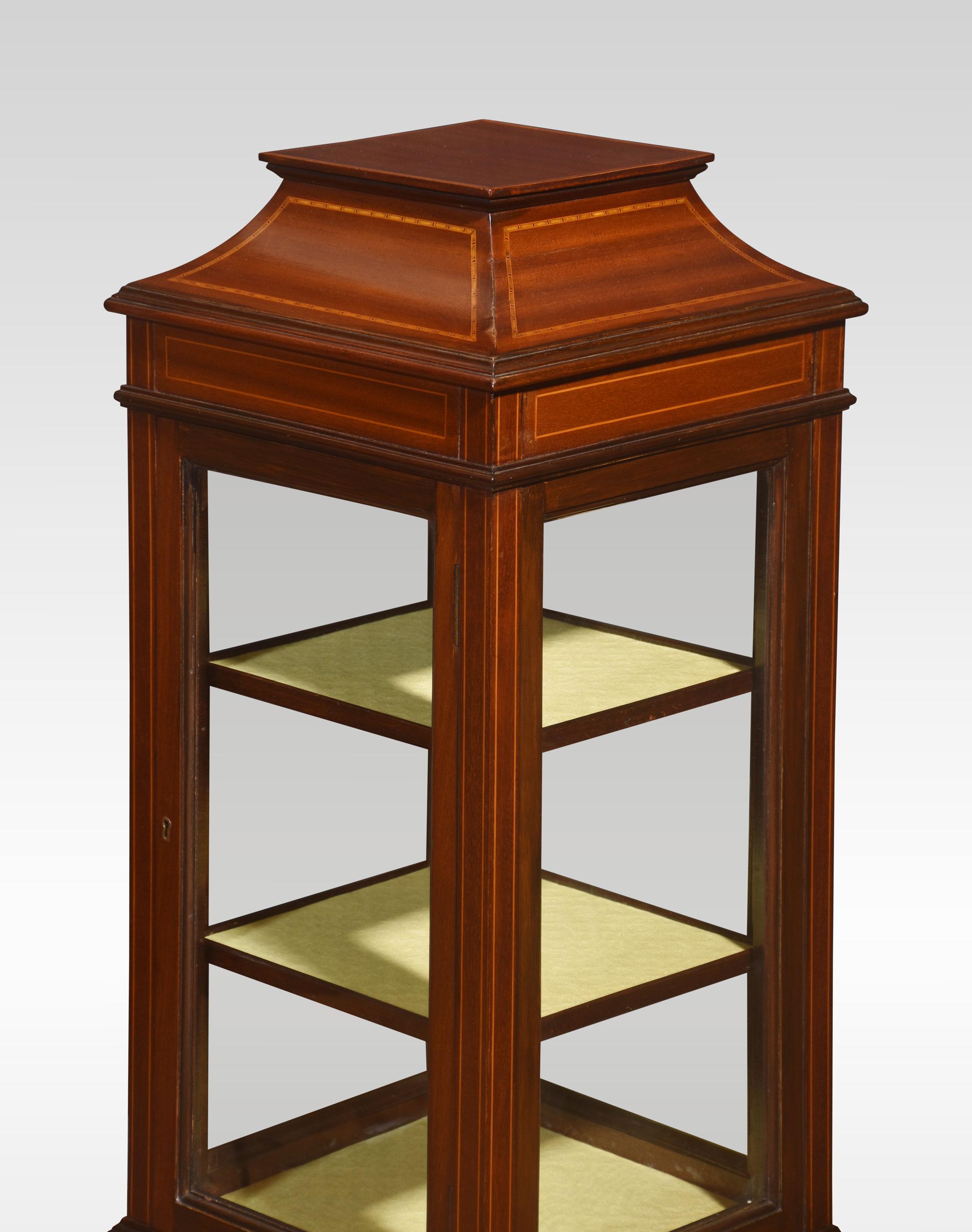 Mahogany inlaid pillar display cabinet, the square top above-glazed door opening to reveal upholstered shelve interior. All raised on tapering legs terminating in spade feet.
Dimensions
Height 38.5 Inches
Width 14 Inches
Depth 14 Inches