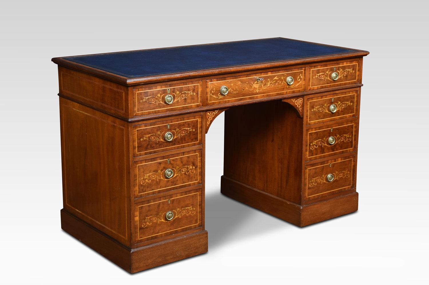 Mahogany inlaid pedestal desk, with blue gilt tooled leather. Over an arrangement of nine drawers, with classical urn and acanthus scrolling inlay. All raised up on plinth base terminating in brass castors.
Dimensions:
Height 30.5 inches height of