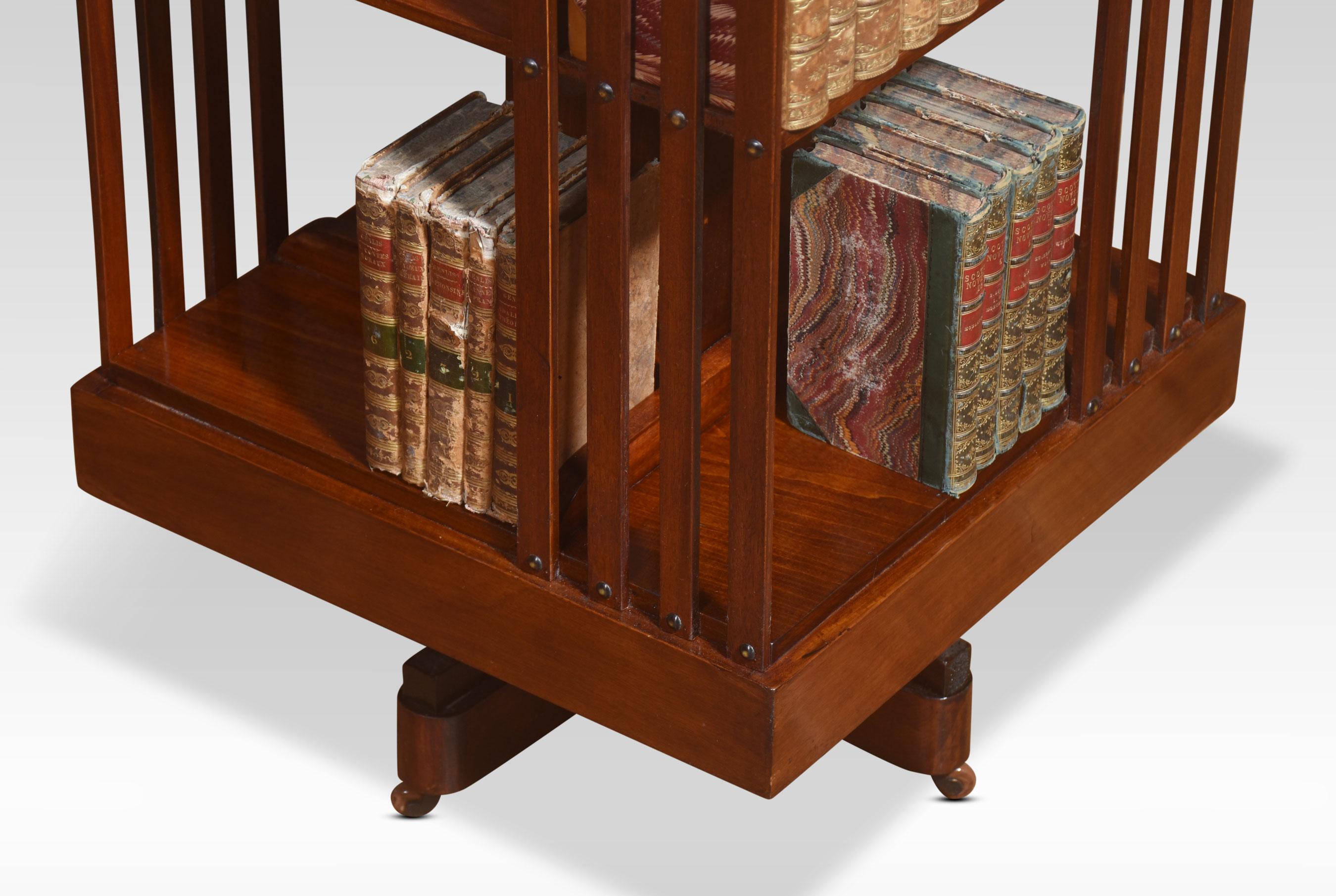 British Mahogany inlaid revolving bookcase For Sale