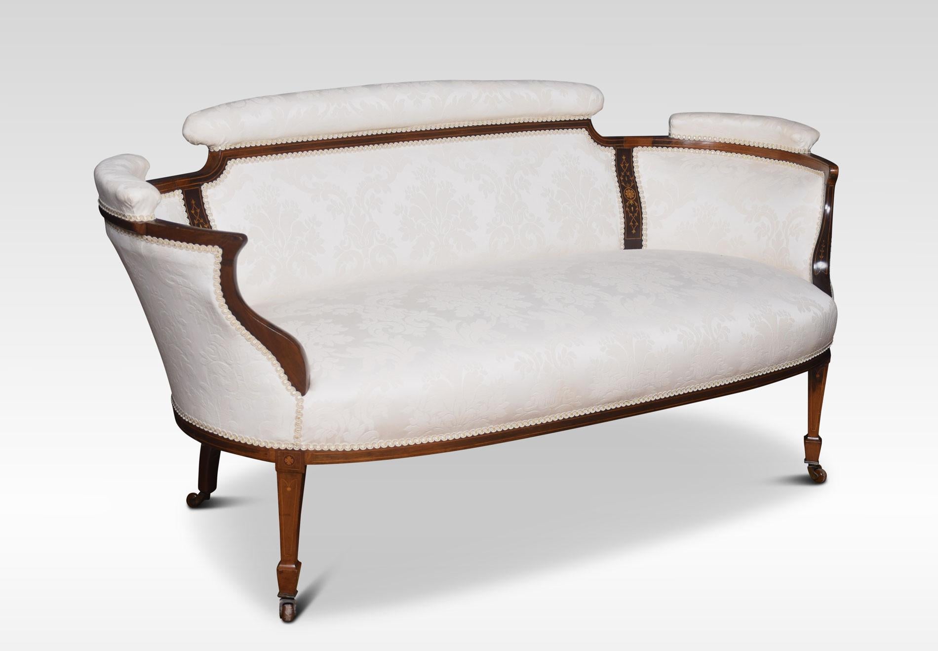 Mahogany inlaid settee the shaped back with inset inlaid panels. Enclosed by out swept arms. To the overstuffed damask upholstered seat, all raised up on square tapering legs and spade feet terminating in ceramic casters.
Dimensions:
Height 28.5