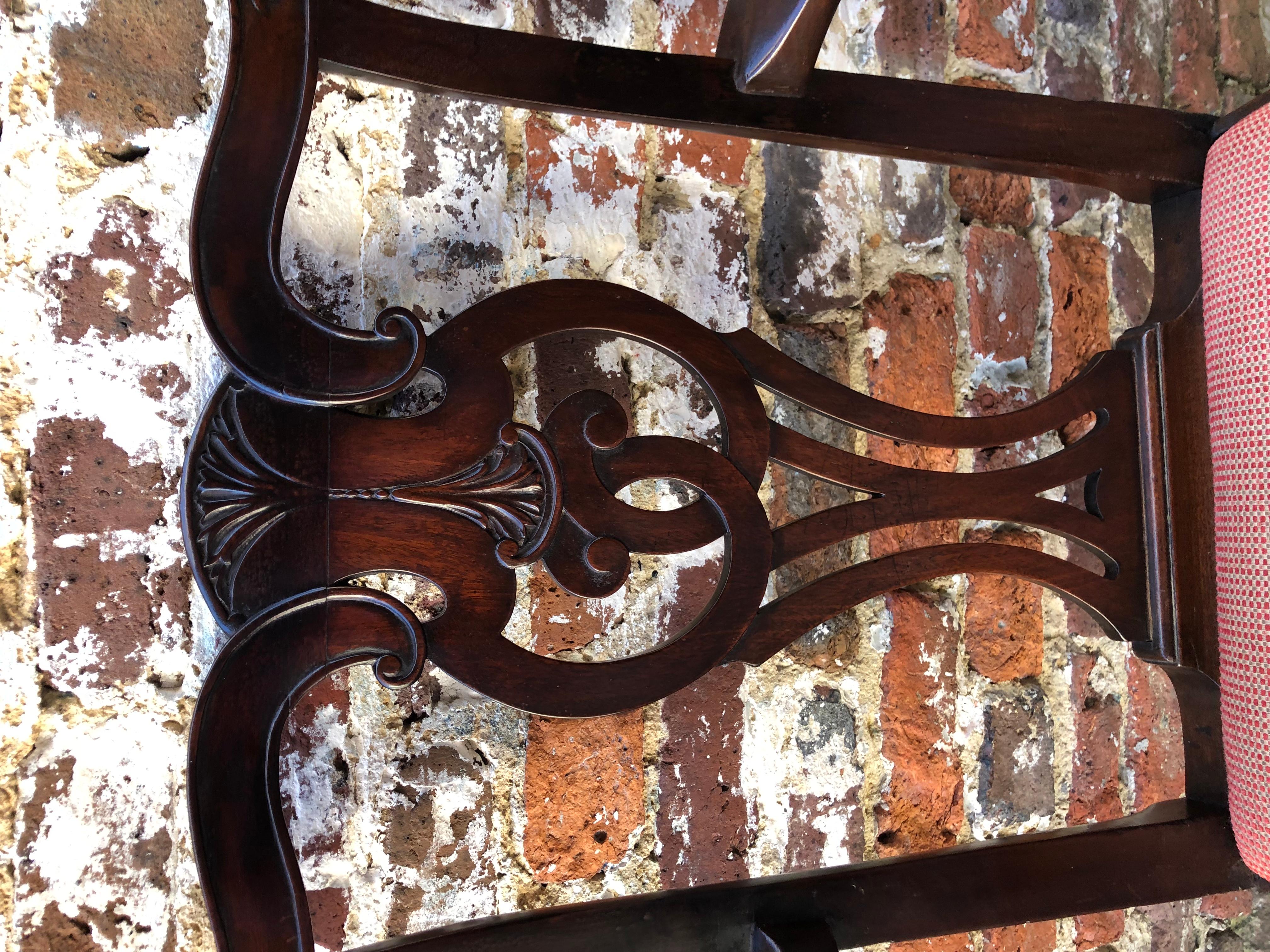 Mahogany Irish armchair with thistle motif on back crest rail.
