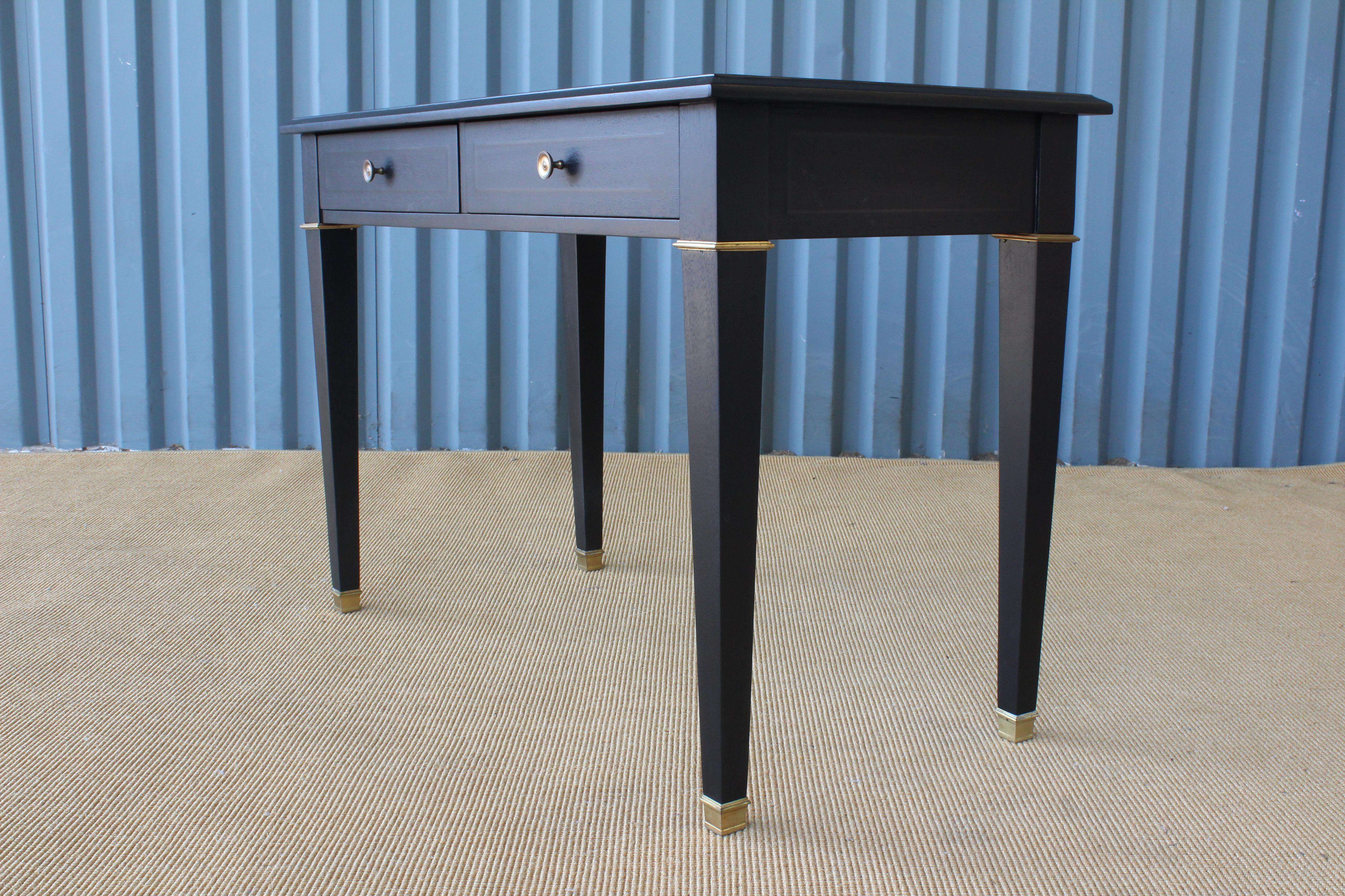 Ebonized mahogany jeweler's desk with brass accents. Perfect as a console. Recently refinished with a new antique mirror top.