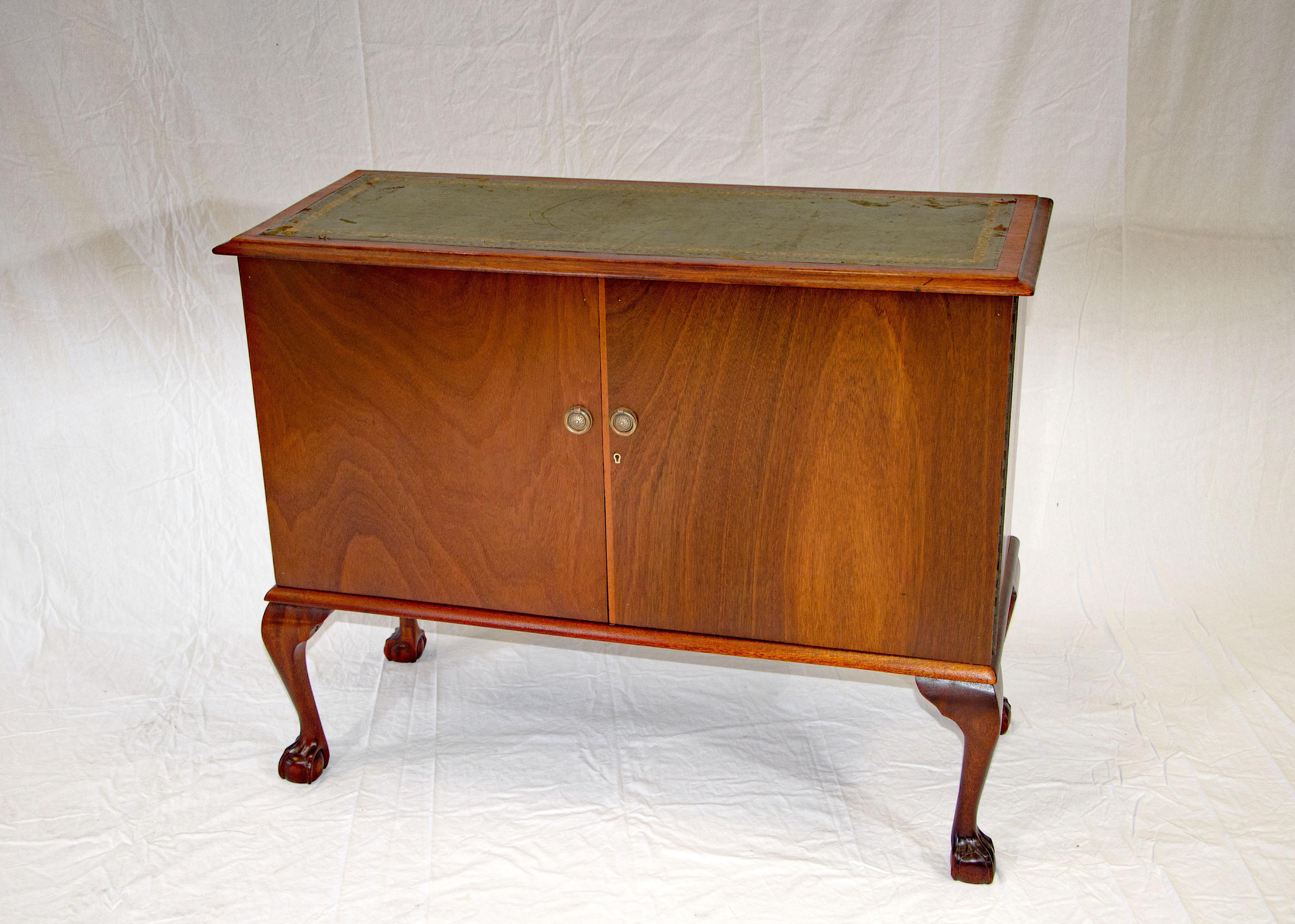 Unusual mahogany cabinet in a more traditional style with ball & claw feet and cabriole legs that are 12