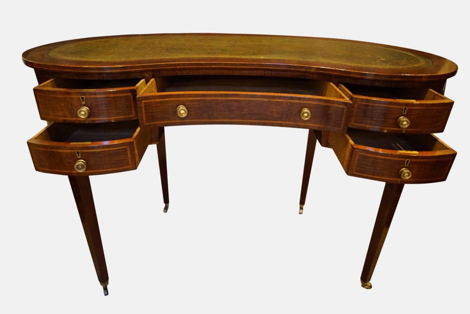 A mahogany kidney shaped desk

circa 1900.