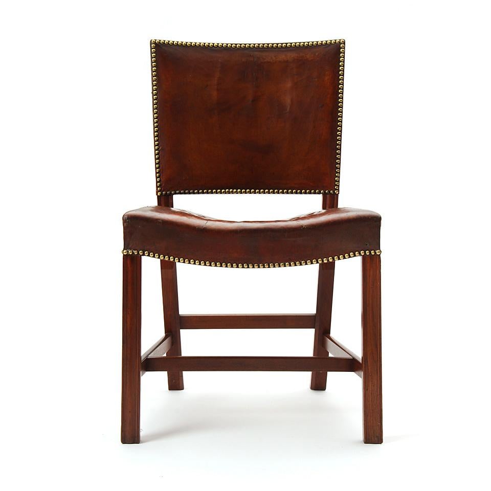 A Cuban mahogany 'Barcelona' dining or side chair designed by Kaare Klint featuring a leather upholstery. Originally introduced at the 1929 International Exposition in Barcelona, Spain. Made by Rud Rasmussen in Denmark, circa 1930s.