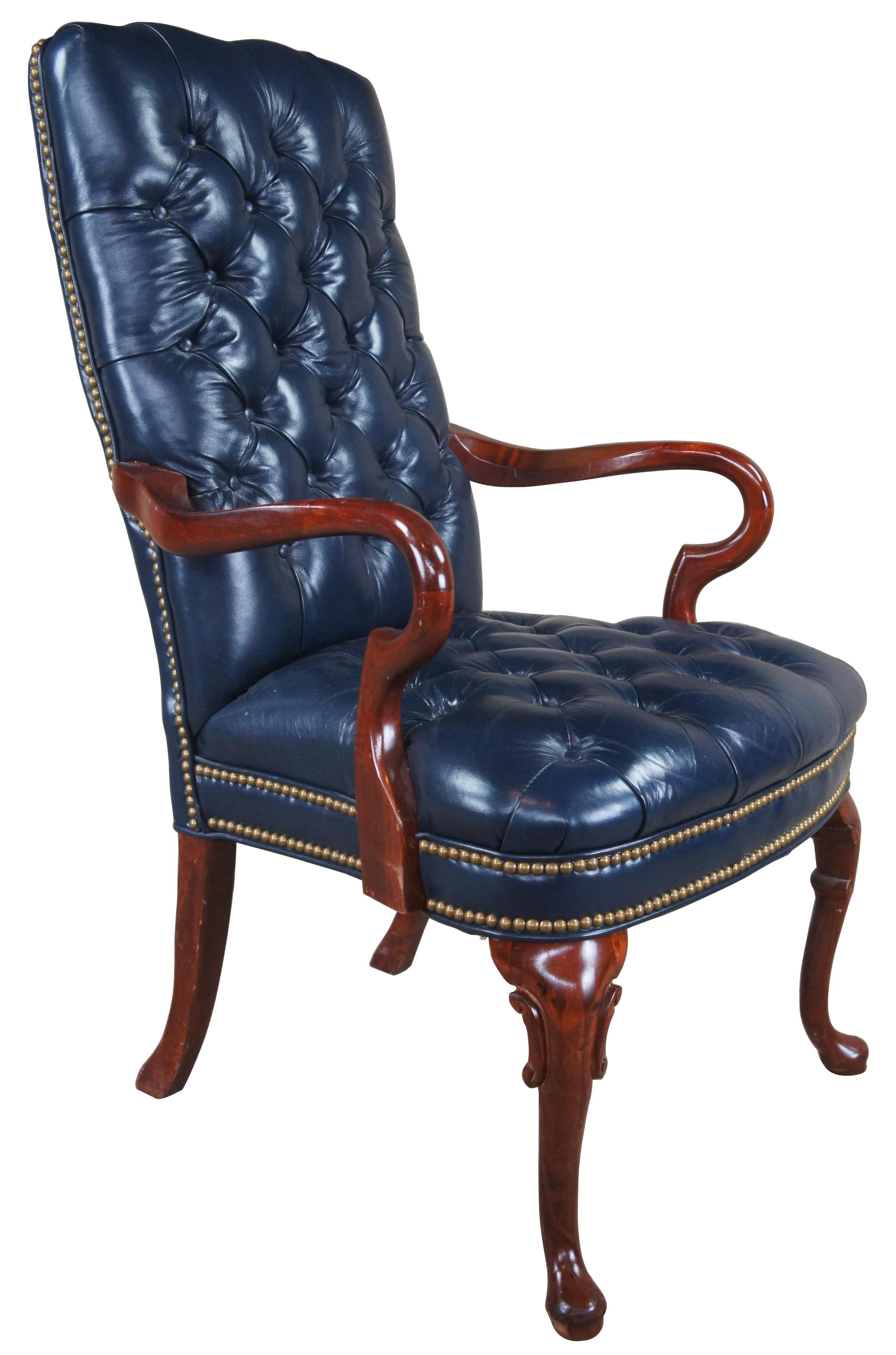 Vintage Queen Anne office or desk chair featuring tufted blue leather with gooseneck arms and nailhead trim.