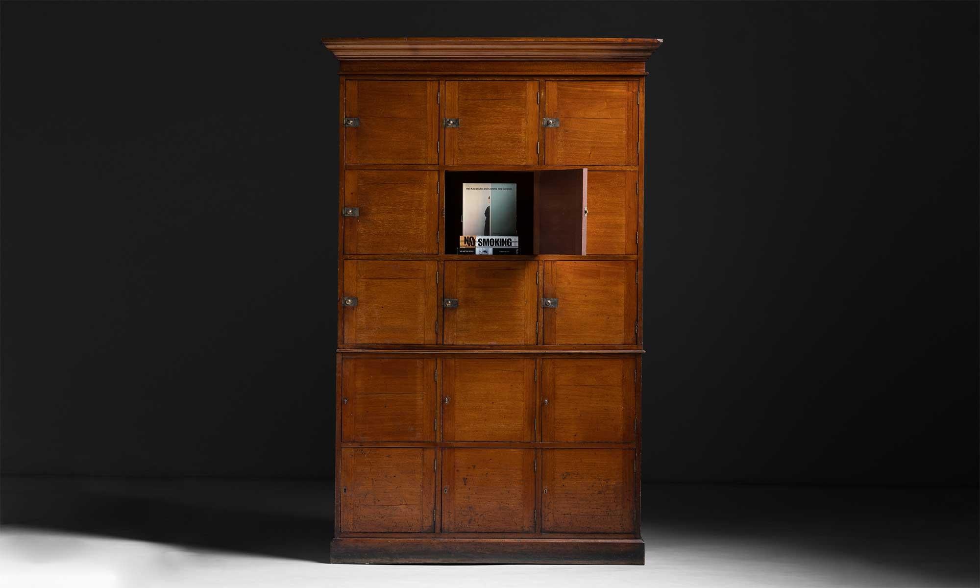 Mahogany Locker, England circa 1860

Finely made cabinets with (15) cubby hole compartments with catch-lock latches.

Measures 52”W x 18.25”D x 80.5”H.