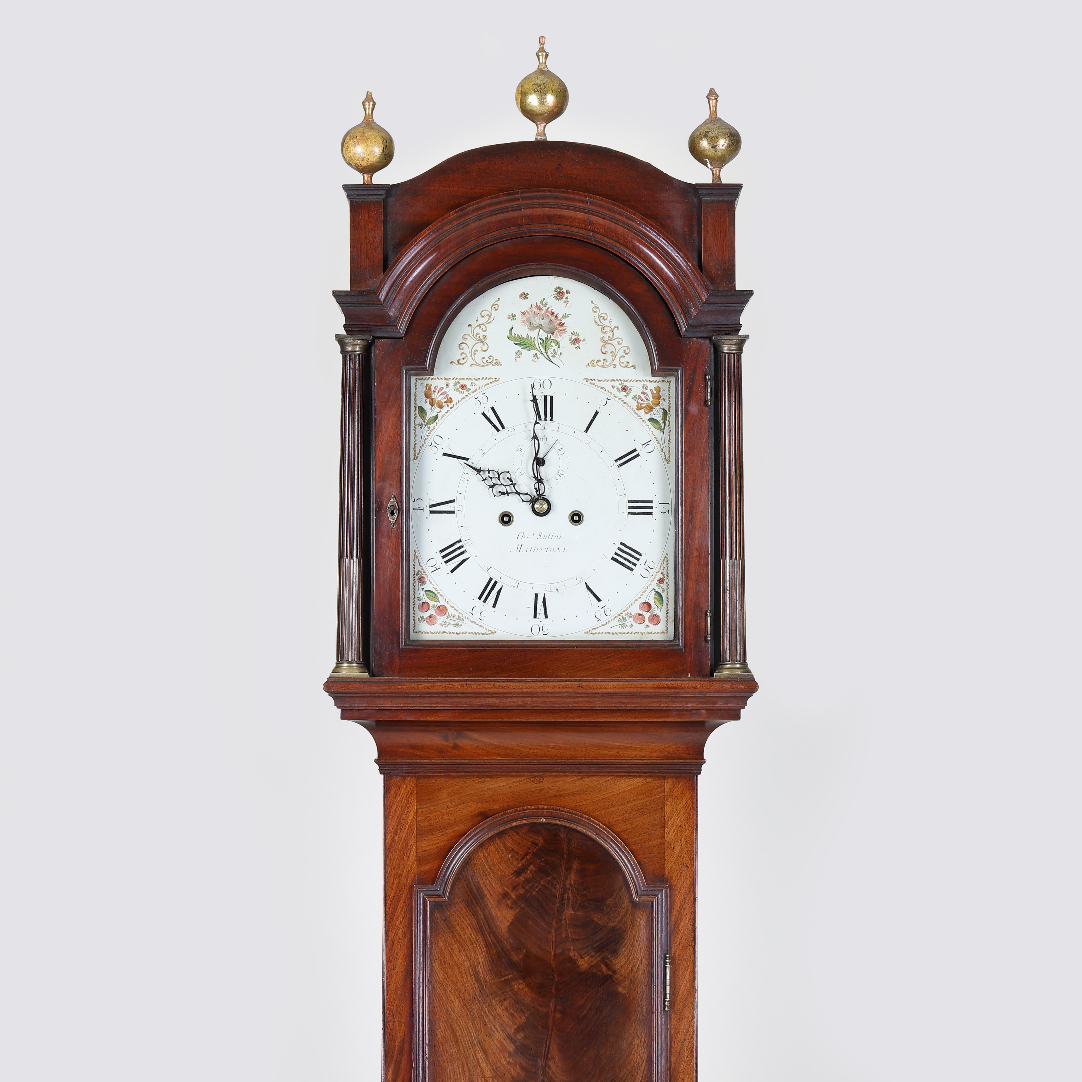 An especially fine late eighteenth century mahogany cased longcase clock by THOMAS SUTTON of MAIDSTONE. The painted dial with ached top having a seconds-ring and central date hand. Unusually high quality having a premium movement with brass cased