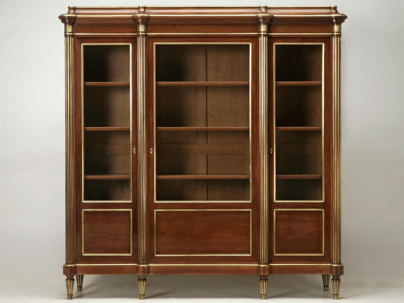 Antique French Louis XVI style mahogany bookcase with brass trim, circa 1890-1910. Usually these are just begging to be ebonized, but the quality of this bibliotheque was so high, and the original French polish finish so good, that I could not bring