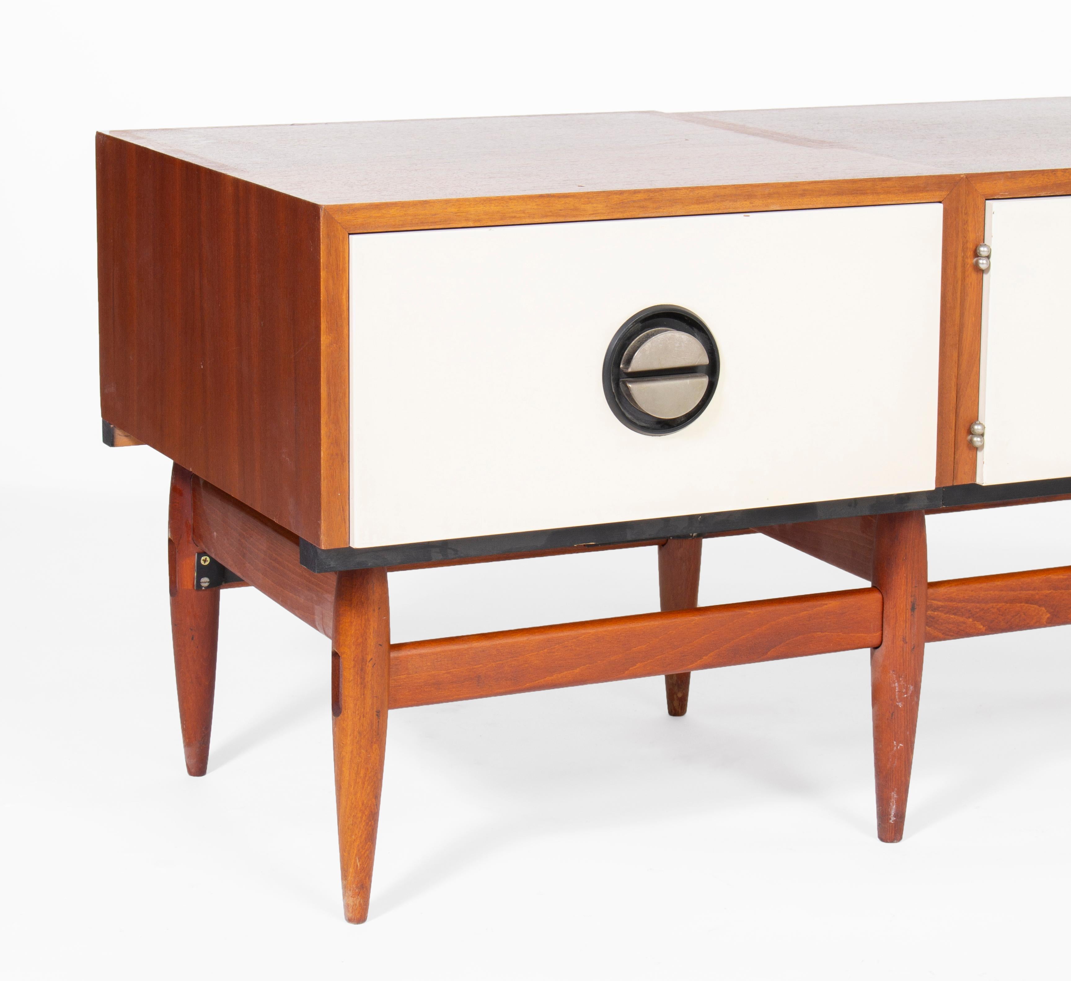 Long walnut media console sideboard with Czeckoslovakian design. Manufactured in the 1970s.