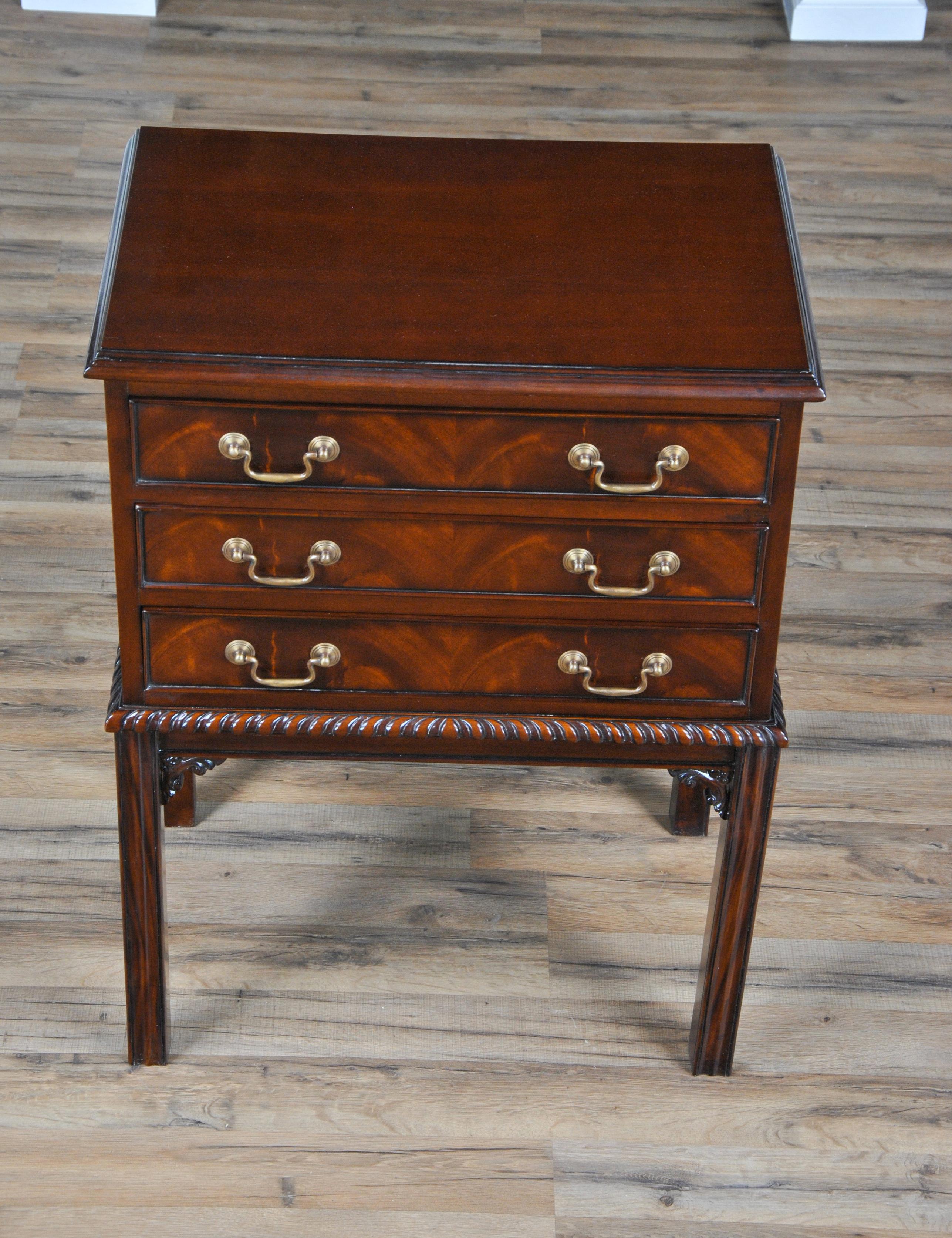 Our most popular mahogany night stand. A fine quality mahogany nightstand, simple yet beautifully detailed. The three wide drawers over top square reeded legs, adorned with hand carved details. Dovetailed drawers for strength and durability.