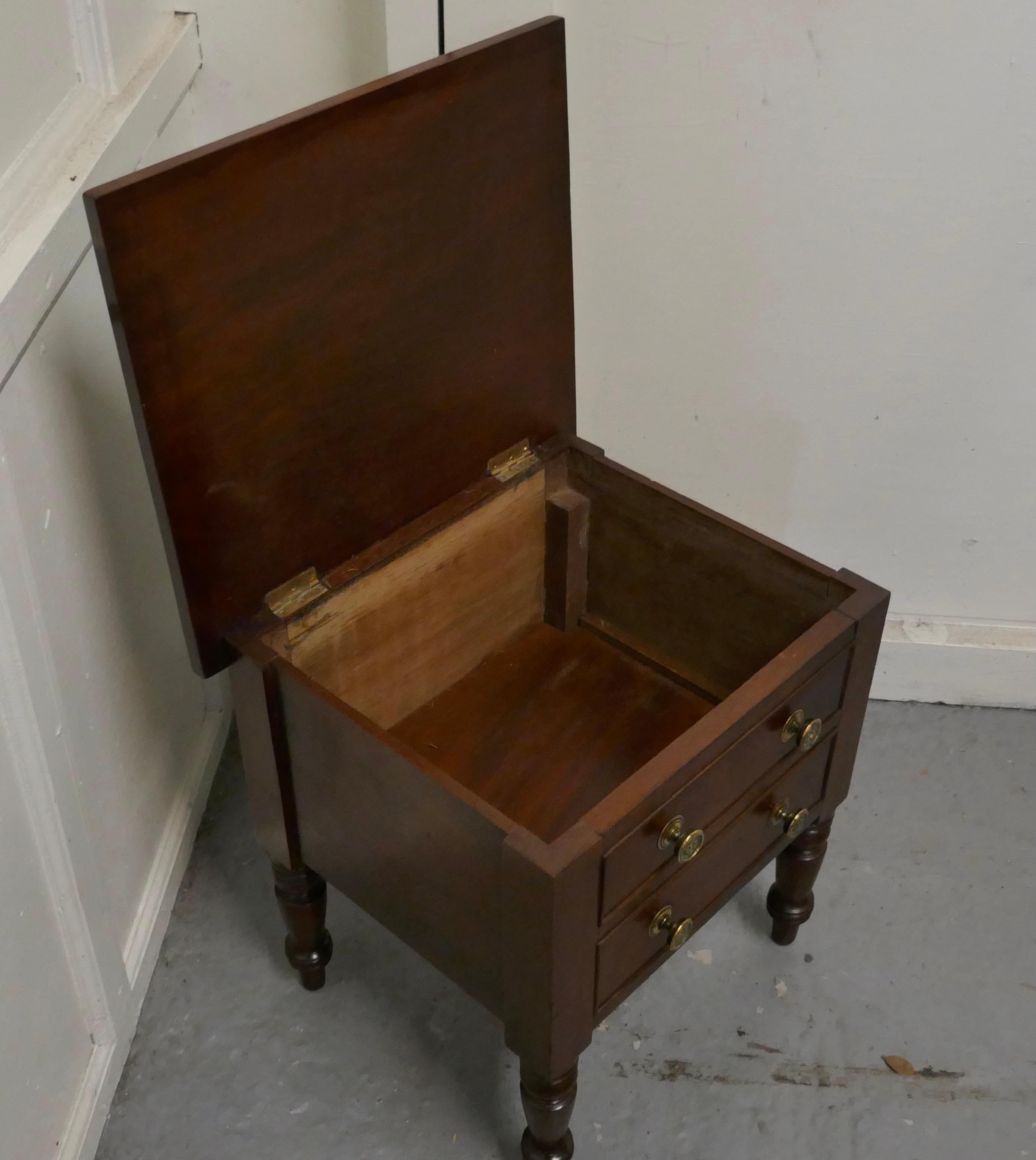 Mahogany occasional table with storage compartment

This is a neat cabinet, it has 2 fake drawers to the front, they disguise a top opening storage box which stands on neat turned legs 
The Table is in good condition it is 18” wide, 18” tall and