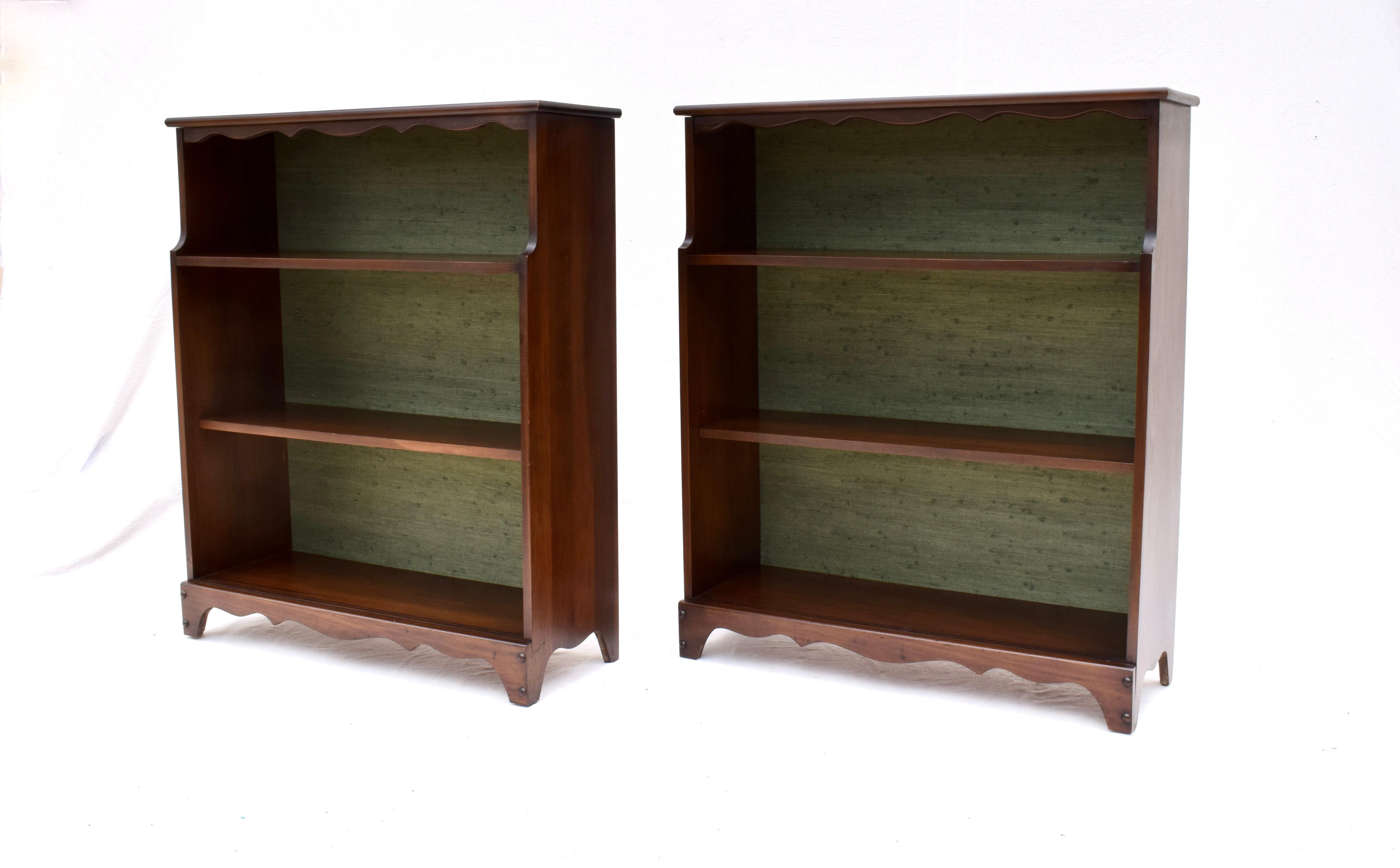 Add marvelous symmetry to any setting with our solid Mahogany vintage bookcases professionally enhanced with striking green grasscloth interiors. Each includes one stationary & one adjustable shelf. Fully hand detailed ready for use, sold as a pair.