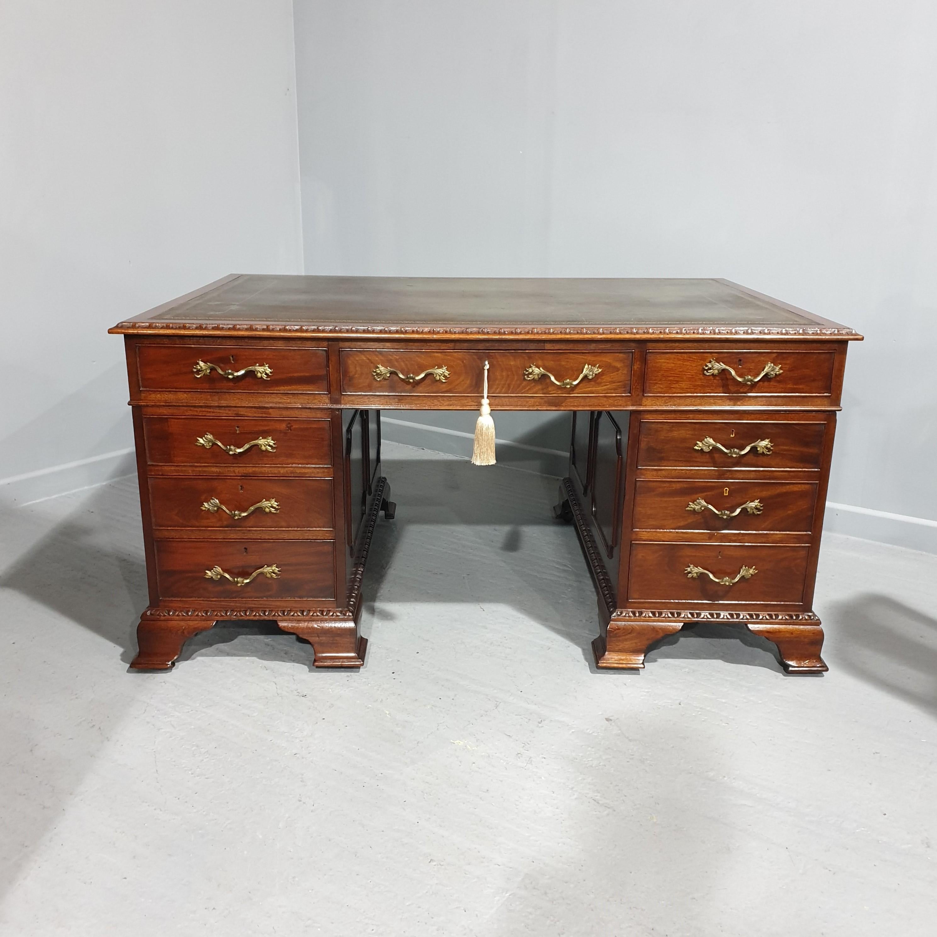 A very nice solid mahogany partners desk with original green leather , wonderful gilt bronze handles, all locks by Hobbs of London, and with a makers badge S & H Jewell, London, in excellent overall condition, splits into three. drawers to one side,