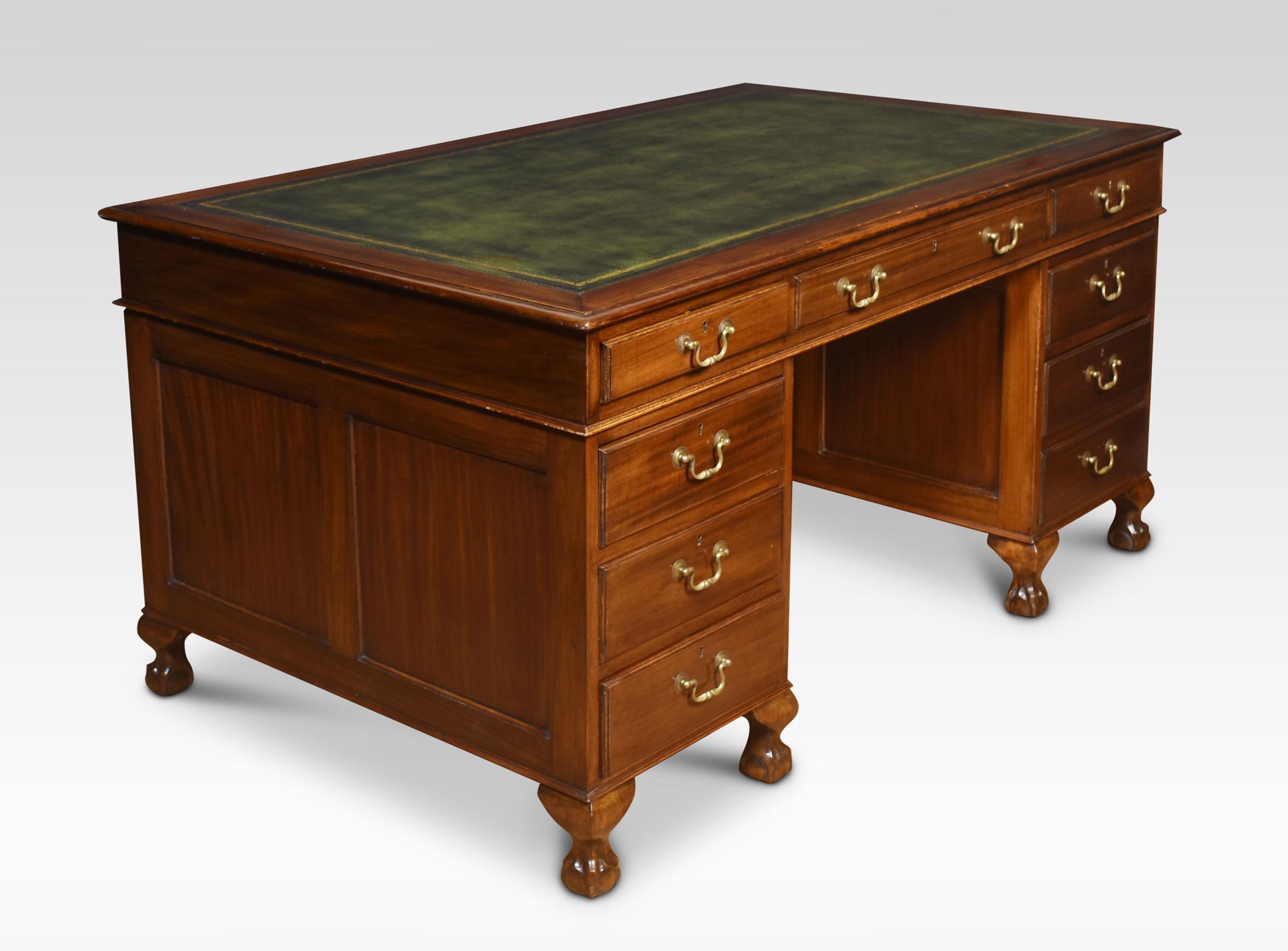 Large mahogany pedestal desk the rectangular top with inset leather having tooled border enclosed by a moulded edge over an arrangement of three freeze drawers. Above two large pedestals one fitted with three graduated drawers, the other having a