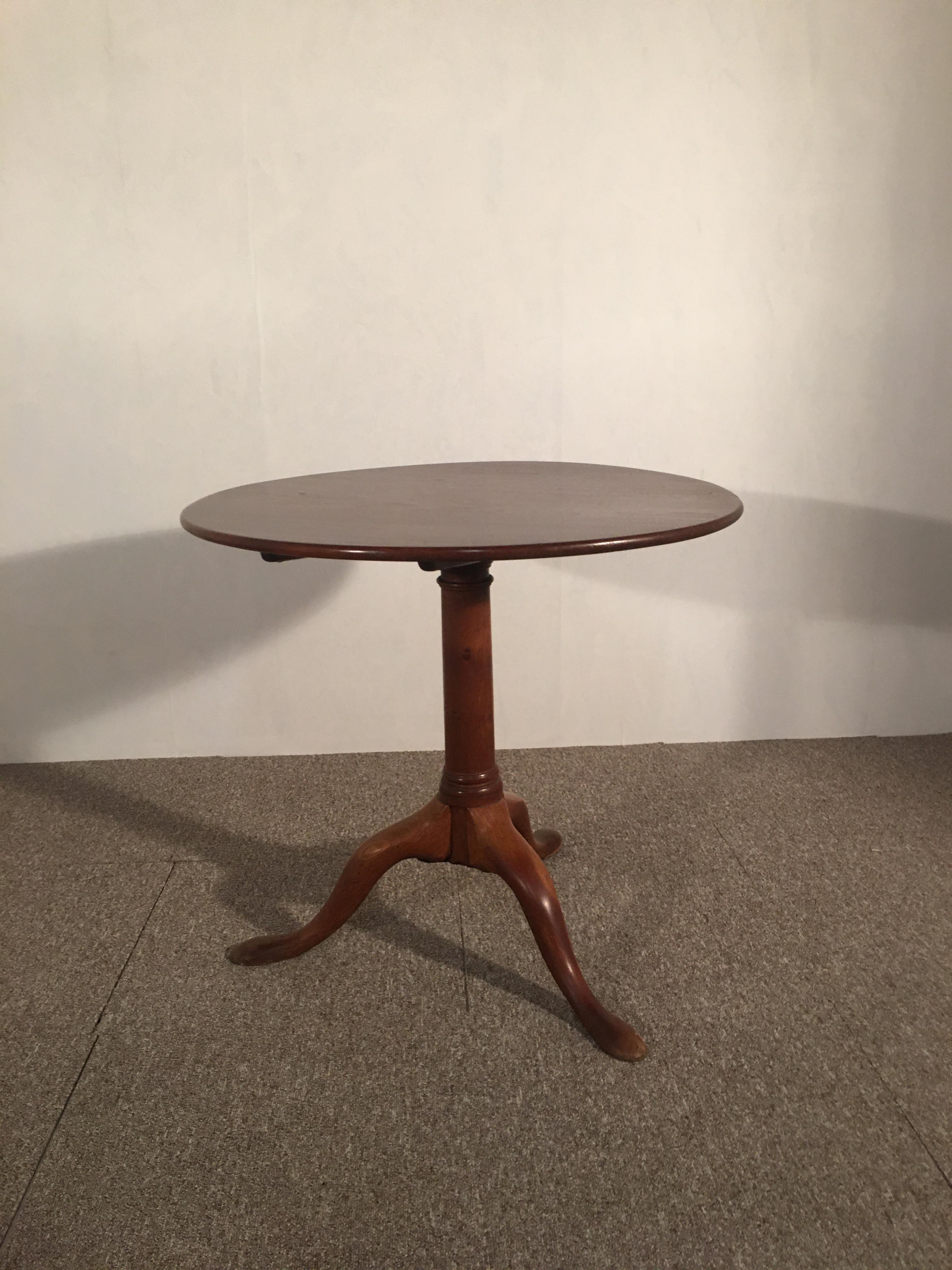 Mahogany pedestal table, 19th, the top folds down, French work, tripod foot.

 
