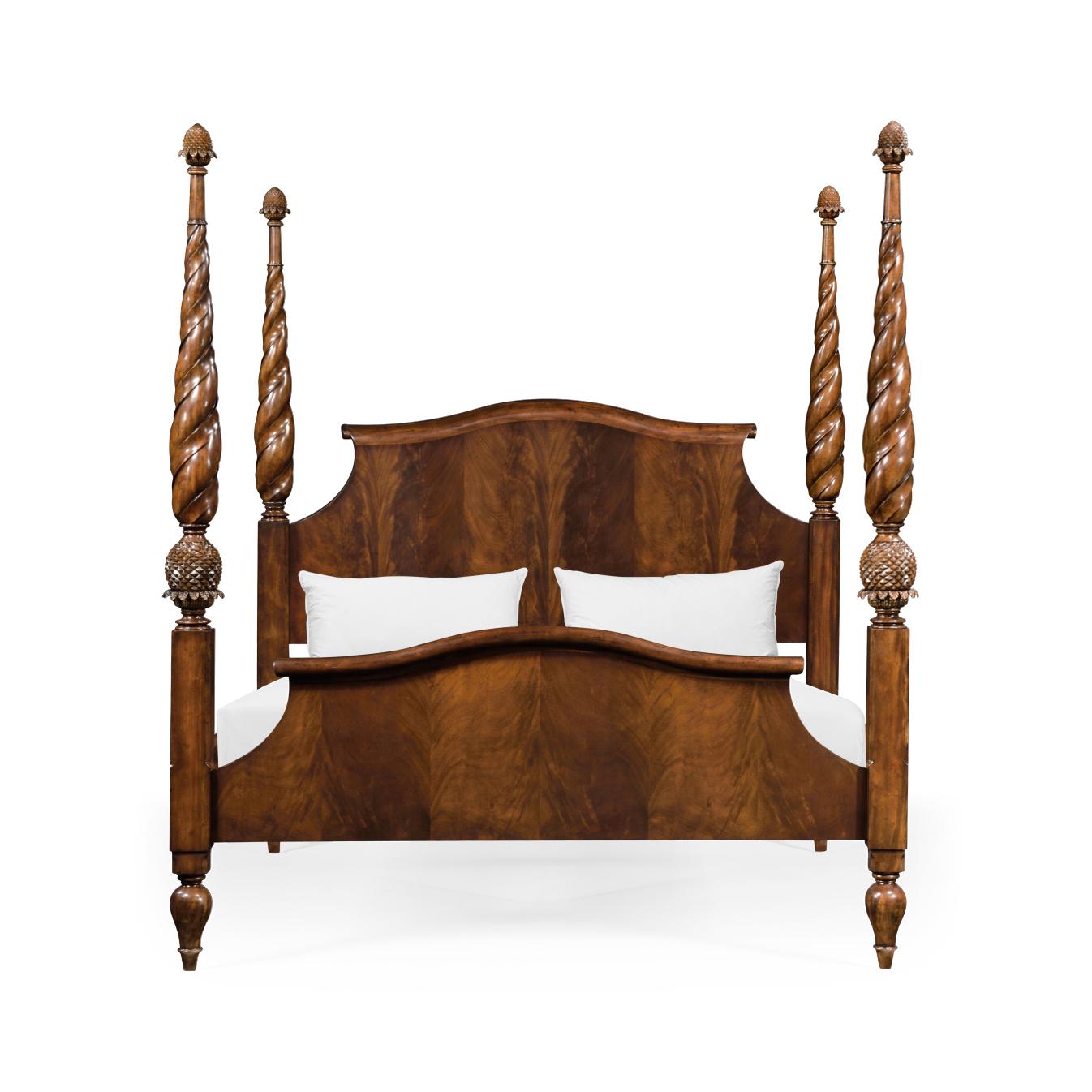 An elegant American plantation style carved mahogany bed with fluted rope twist tapered carved posts with beautifully hand carved acorn finials and an arched headboard of figured mahogany with a scroll top, the frame, and footboard of figured