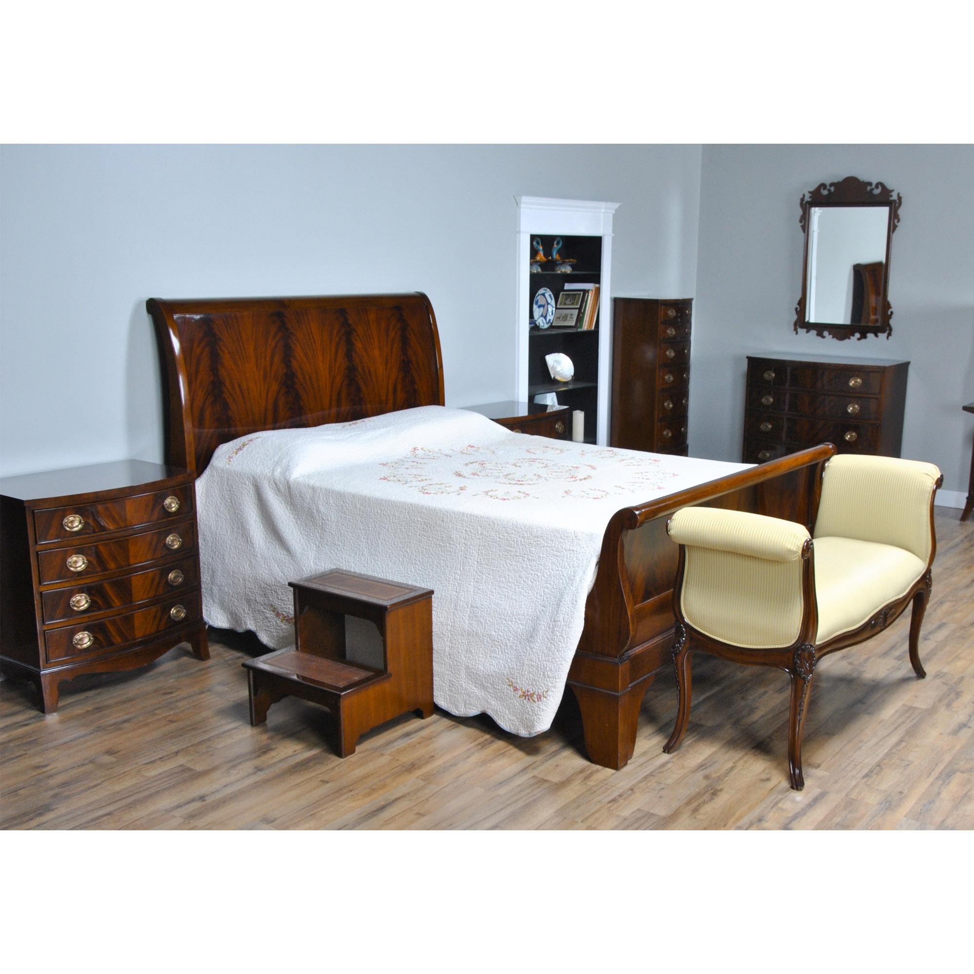 This is a Mahogany Queen Size Sleigh bed. The bed features a great quality solid mahogany frame along with the finest quality veneered panels which combine to form a sleek and elegant design that will compliment any decor. Also known as a platform