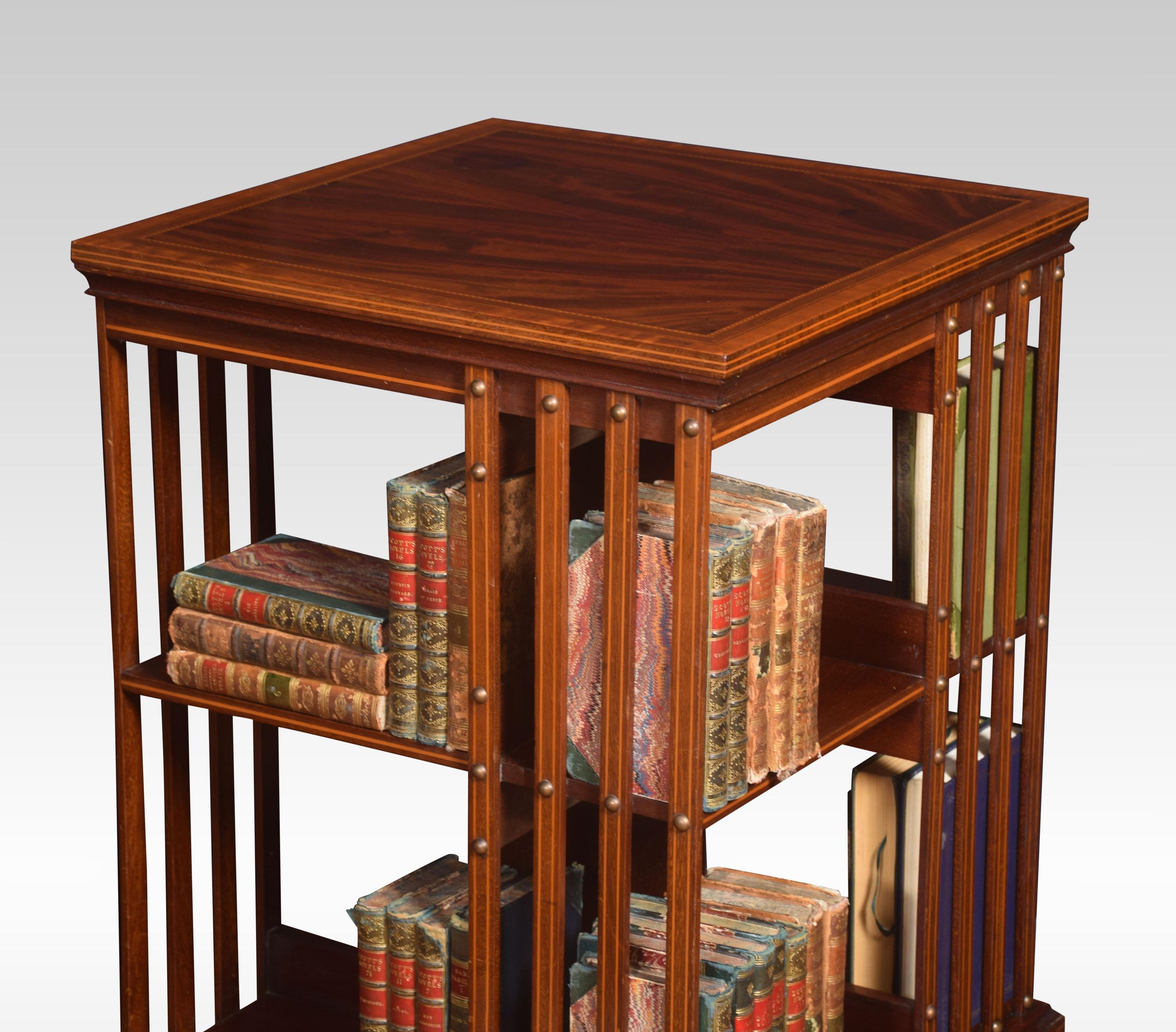 Mahogany revolving bookcase the square top with satinwood crossbanded edge. Above an arrangement off shelves raised up on cruciform base with castors.
Dimensions
Height 34 inches
Width 19.5 inches
Depth 19.5 inches.