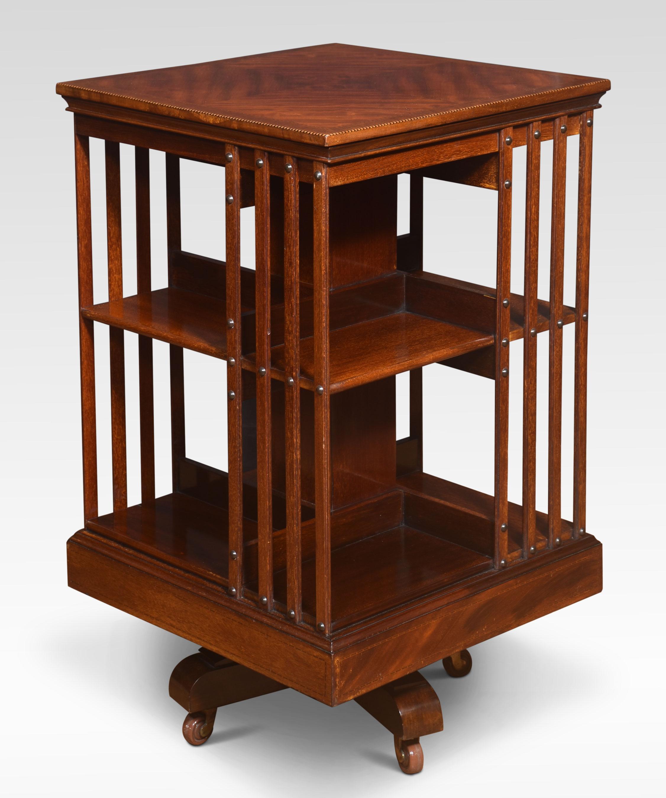 Mahogany revolving bookcase the well-figured top. Above an arrangement of shelves raised up on a cruciform base with ceramic castors.
Dimensions
Height 34 Inches
Width 20 Inches
Depth 20 Inches
