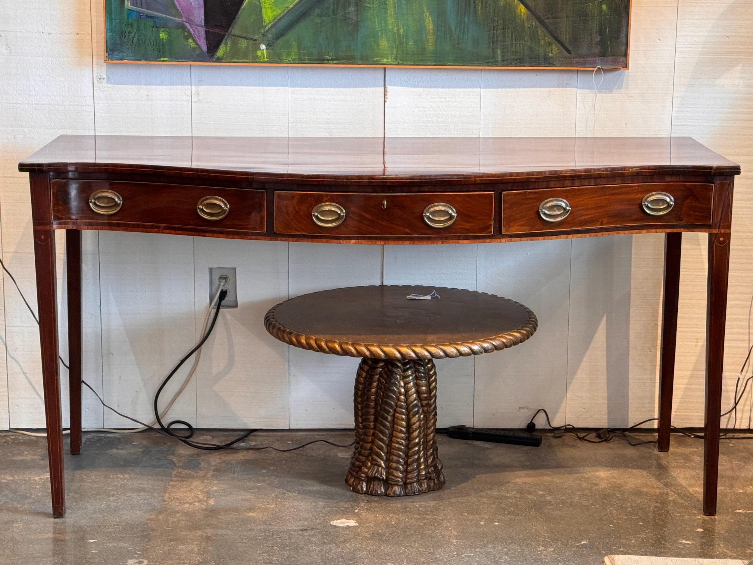 This elegant mahogany server has the best color and patina. With three drawers.