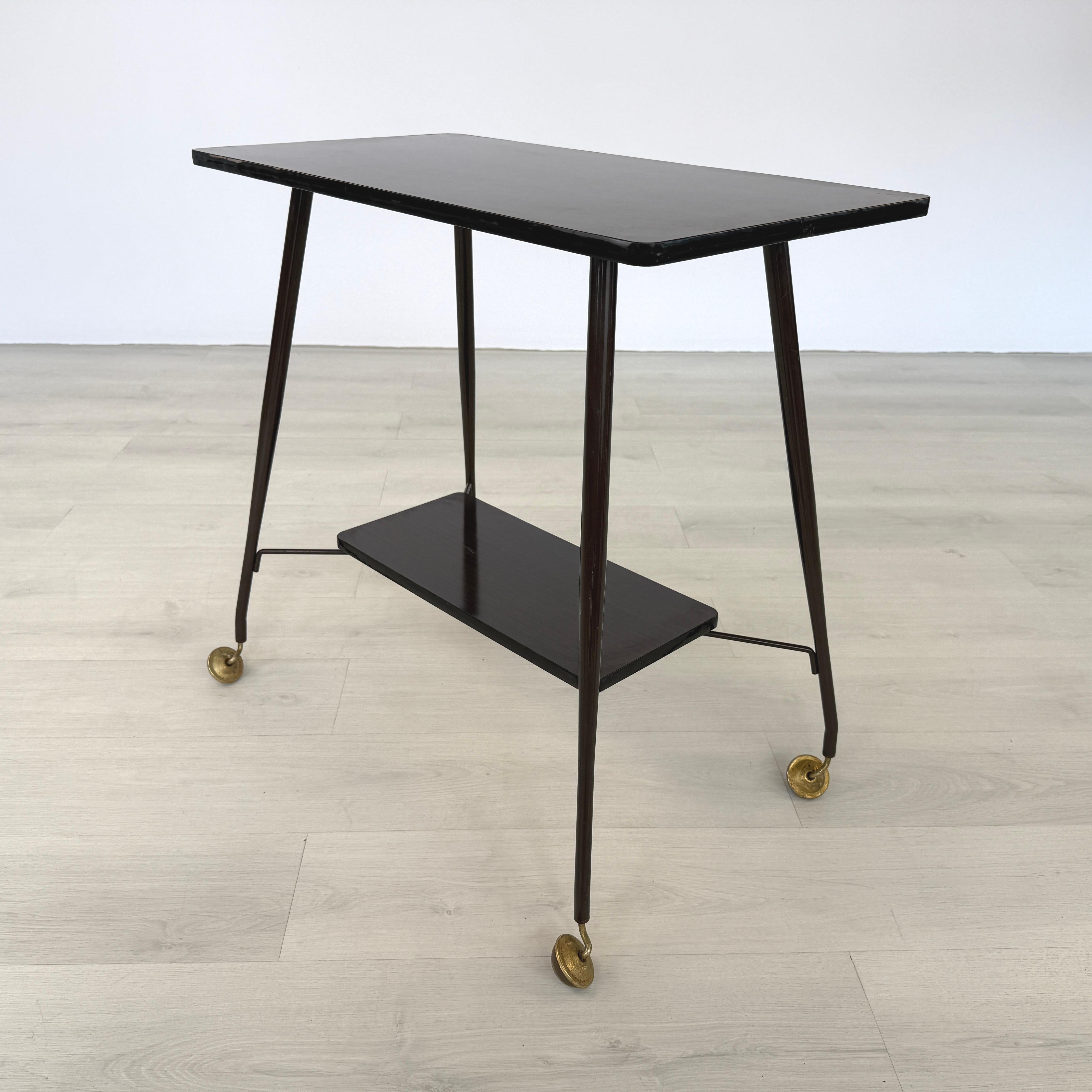 Dimensions: H 28.7” x W 29.7” x D 16”

Mid-Century Modern mahogany side table or serving trolley on wheels with lower shelf.

Please see our other listings for ideas and matching pieces.

Condition: Vintage condition, some scratches may be present.