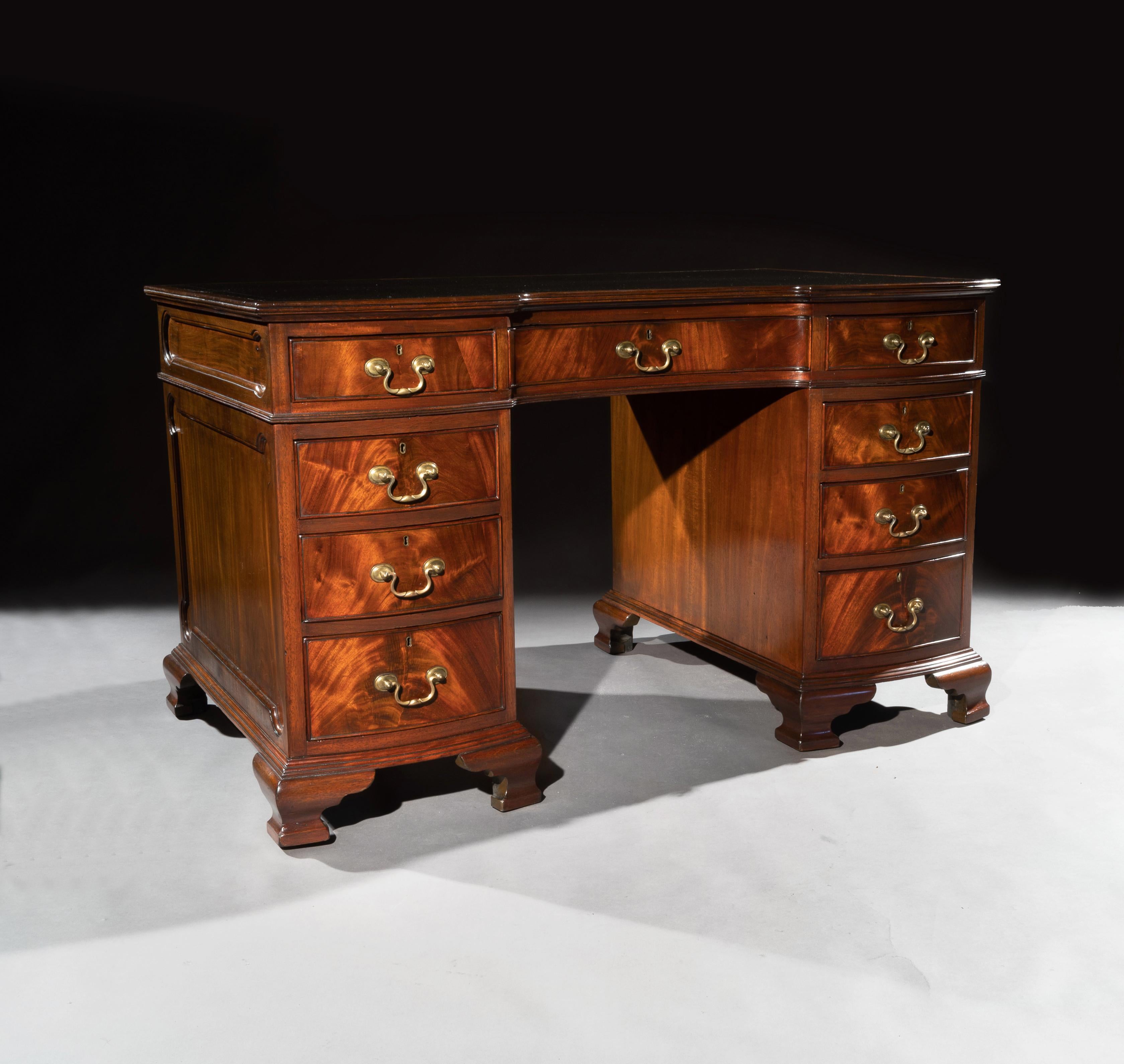 A good quality early 20th century shaped front pedestal desk by S & H Jewel of Holborn, London.

English, London, made circa 1900.

Constructed from fine quality mahogany, the rectangular shaped top having a thin cross-banded mahogany border,