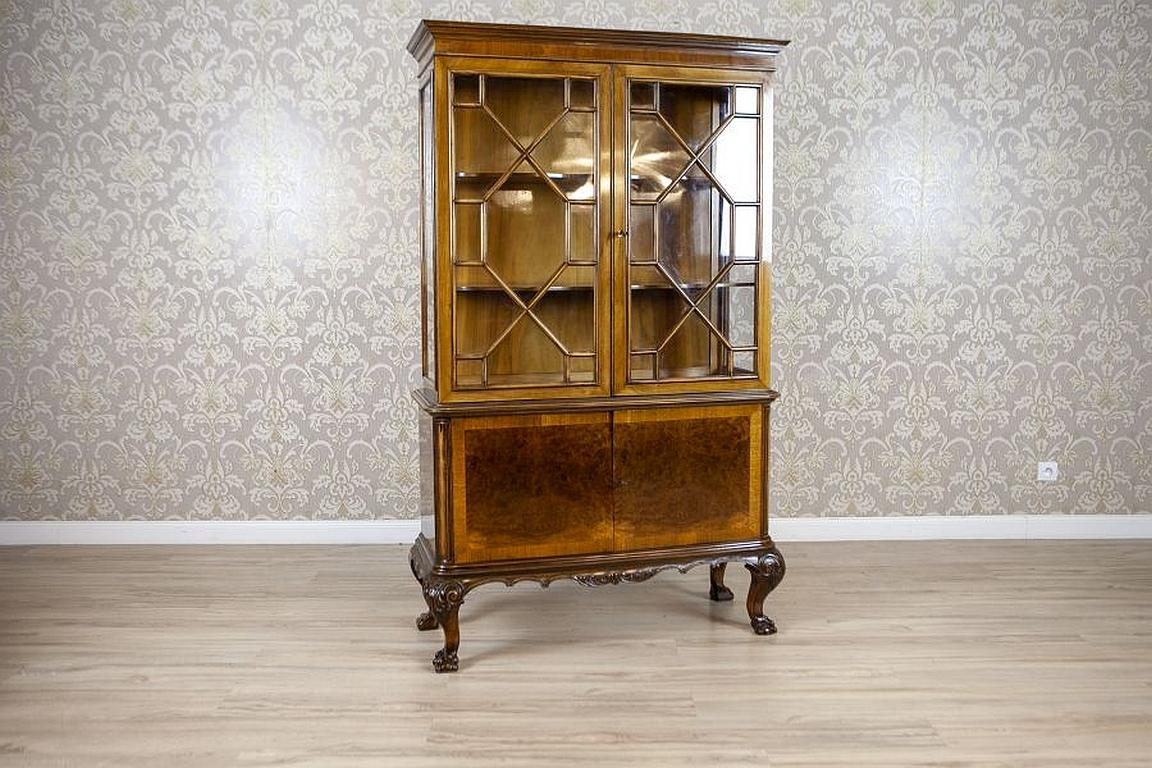 Mahogany Showcase from the 1930s Stylized as Chippendale Furniture

We present you this mahogany wood and veneer showcase circa 1930s, which is stylized as Chippendale furniture.
The two-door corpus in supported on bent legs finished with paws.