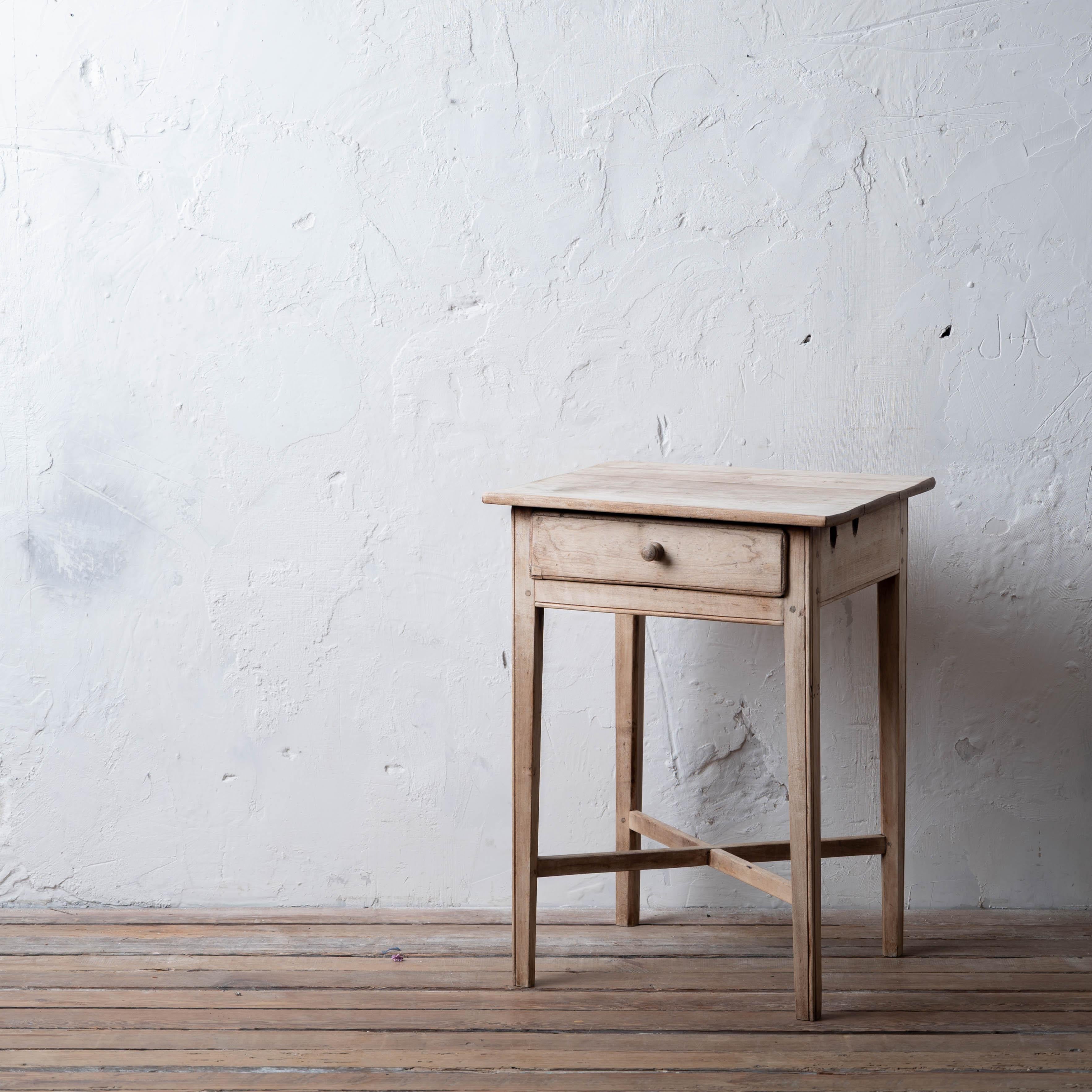A bleached mahogany one drawer side table with cross stretcher, 18th century.



19 ¼ inches wide by 16 ¾ inches deep by 26 ½ inches tall



