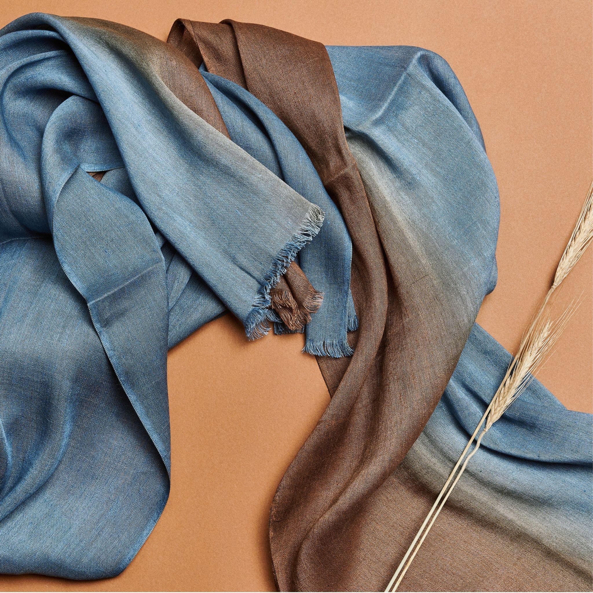 Mahogany Sky is a timeless scarf handwoven by weavers in Nepal.Soft in hand feel this classic scarf has been hand dyed in ombre effect to give it a soothing look that also makes it a unisex piece.

This scarf can be worn all year around, suitable