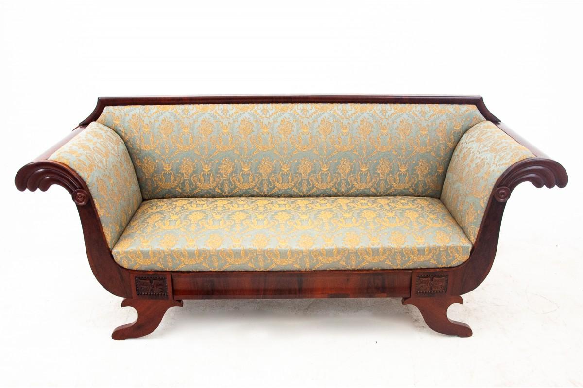 The mahogany sofa comes from Western Europe from the 19th century. Biedermeier style sofa. The furniture has been renovated and the upholstery has been replaced with a new blue and gold fabric.

Dimensions:

Height: 93cm

Seat height: 46cm

Width: