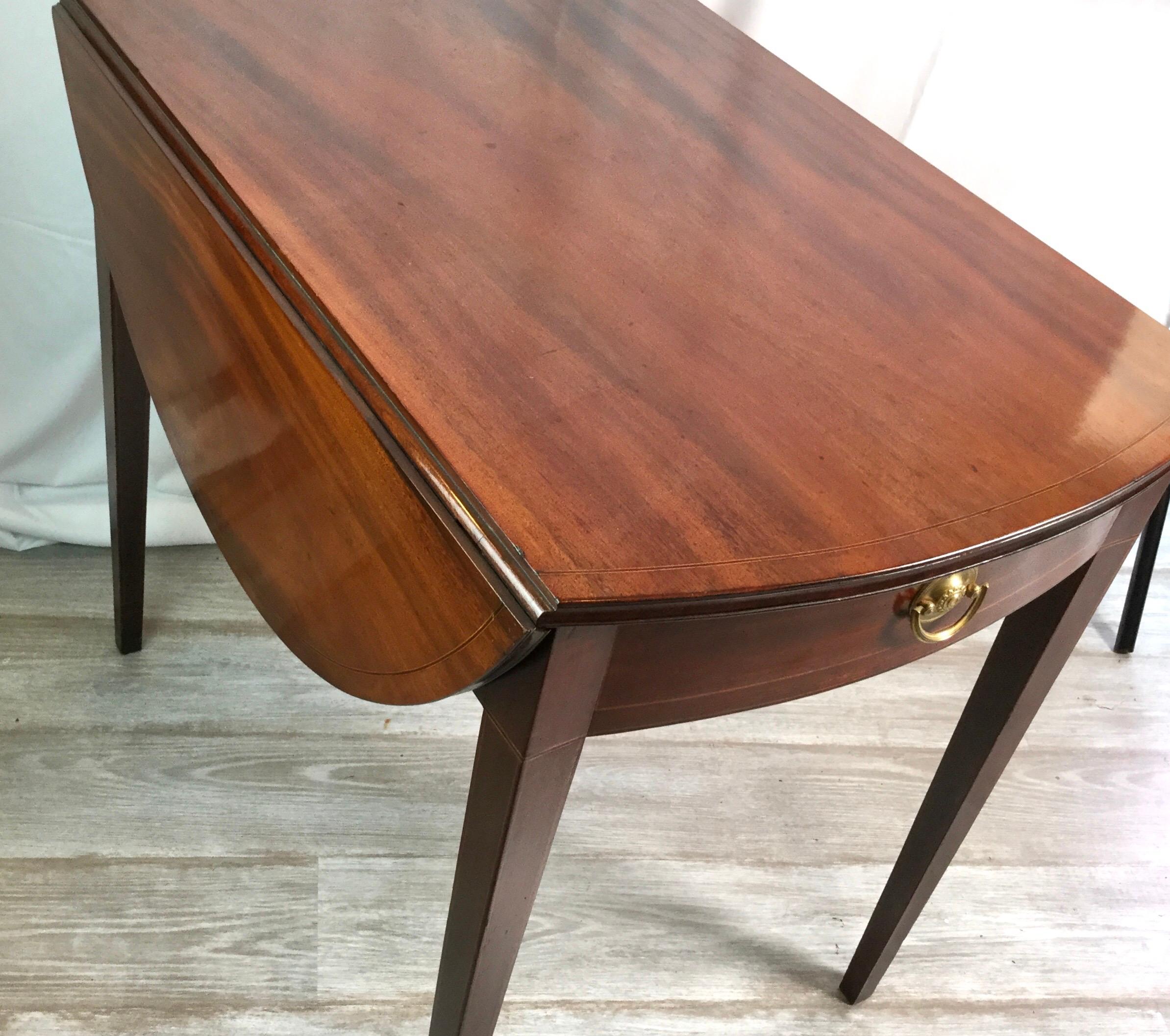 Beautiful mahogany string inlay pembroke table. Single drawer with faux drawer on other side. String inlay on legs and top. Some surface rubs consistent with age and use. Closed 20 1/2
