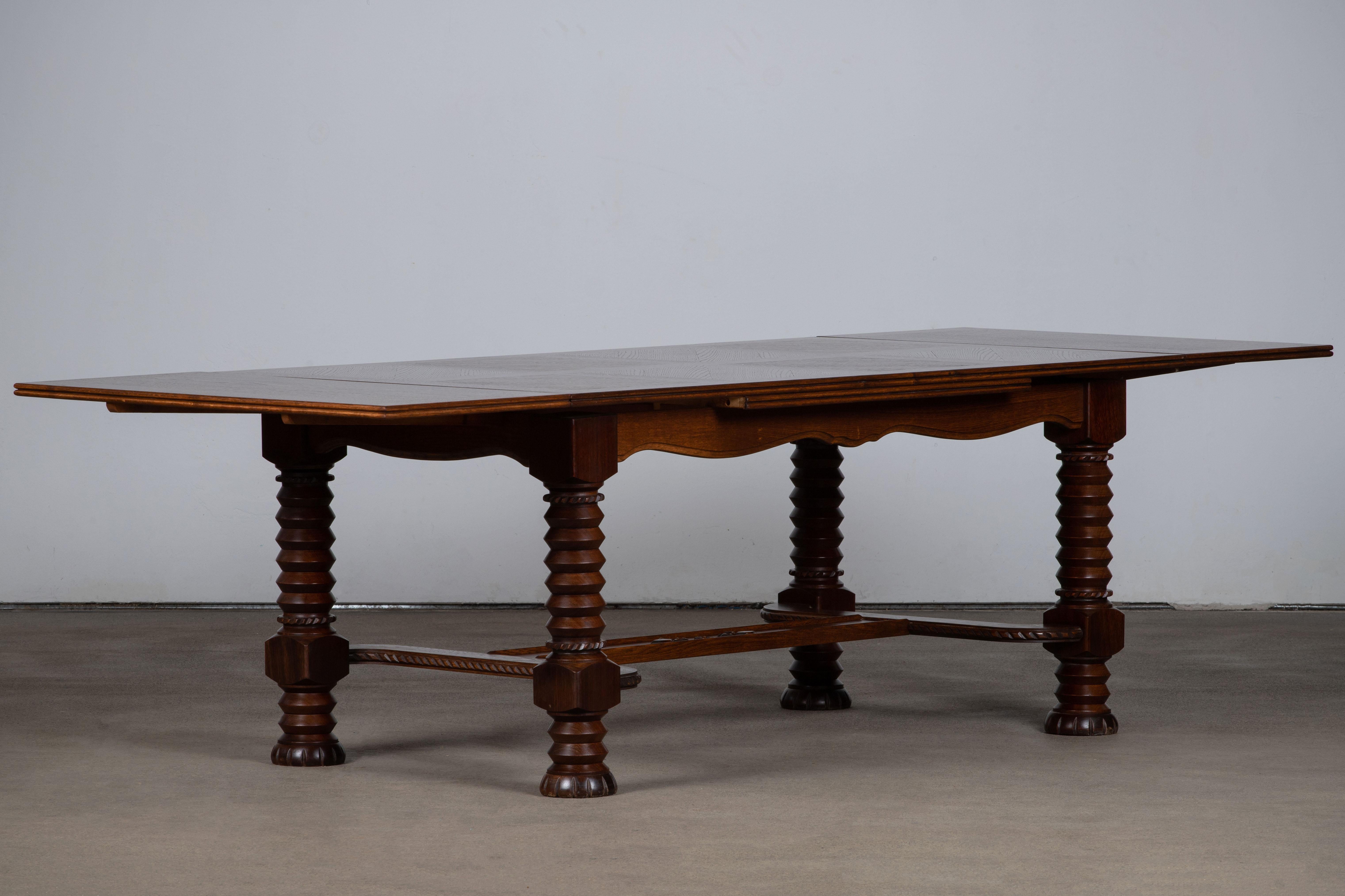 French Art Deco dining table in mahogany, 1960s, France.
The table is in excellent original condition, with minor wear consistent with age and use.
A truly incredible piece in style of Charles Dudouyt.
 