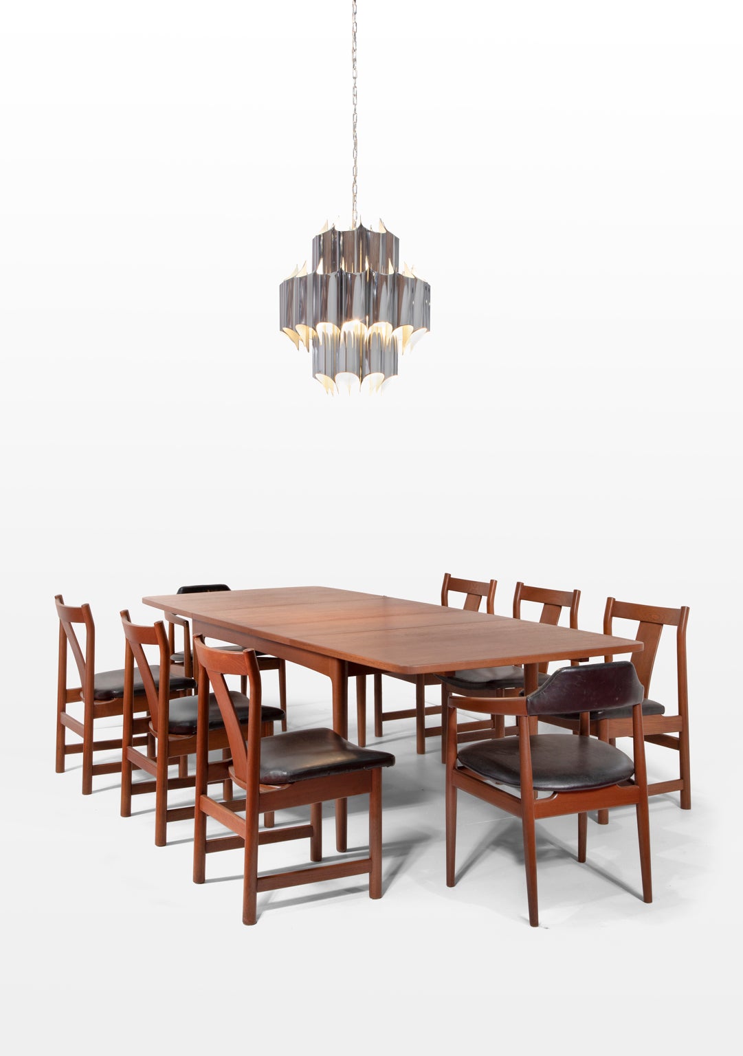 SALE ONE WEEK ONLY

Rare Mid-Century Modern dining table and eight  dining chairs with  black leather seats by Erik Worts for Henrik  Worts Mobelsnedkeri, Denmark. A beautiful hand-crafted arrangement that is stunning with beautiful clean lines.