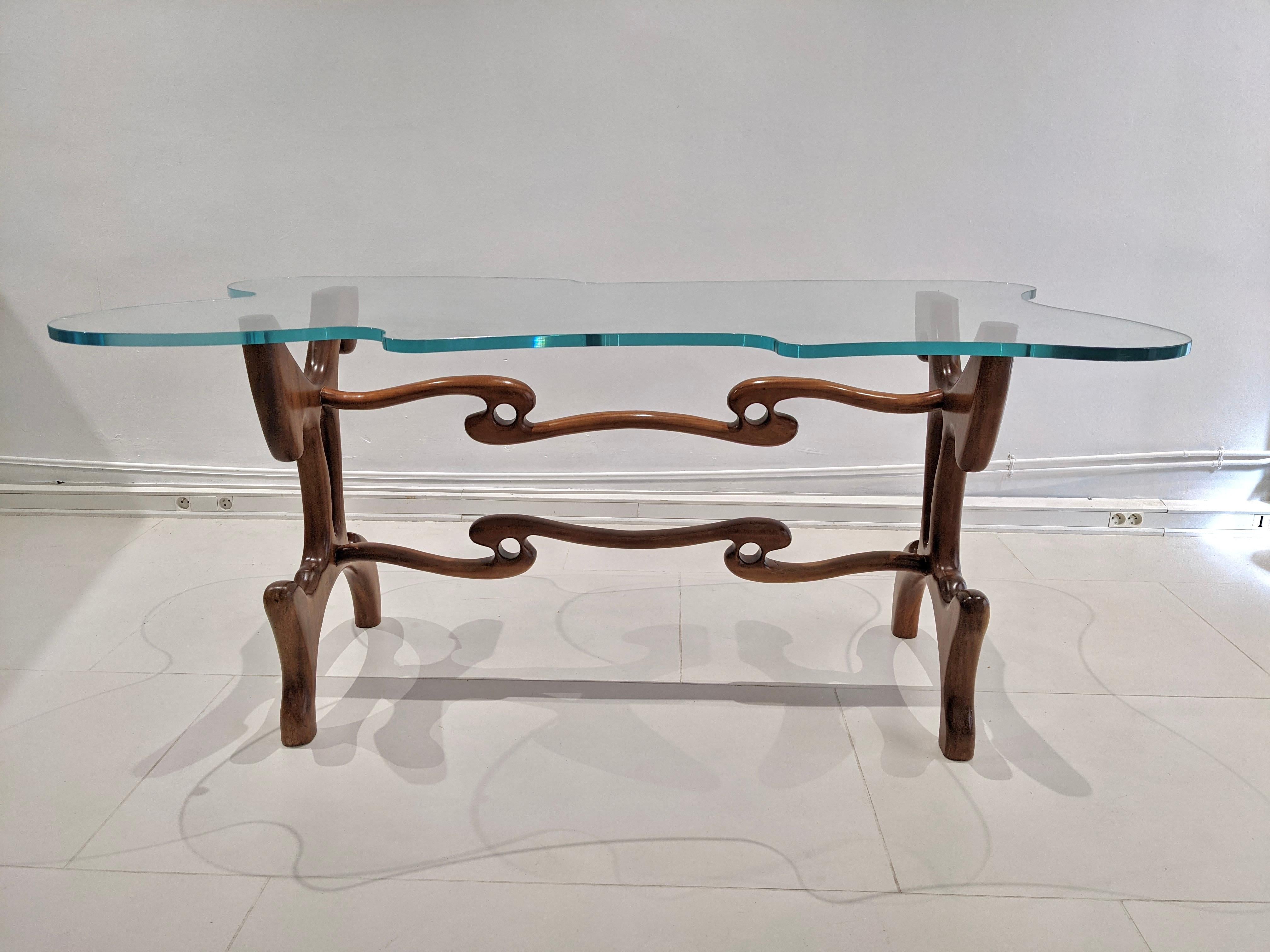 Mahogany table by Paul Laszlo. Glass top. Year 1950. Very good condition.
