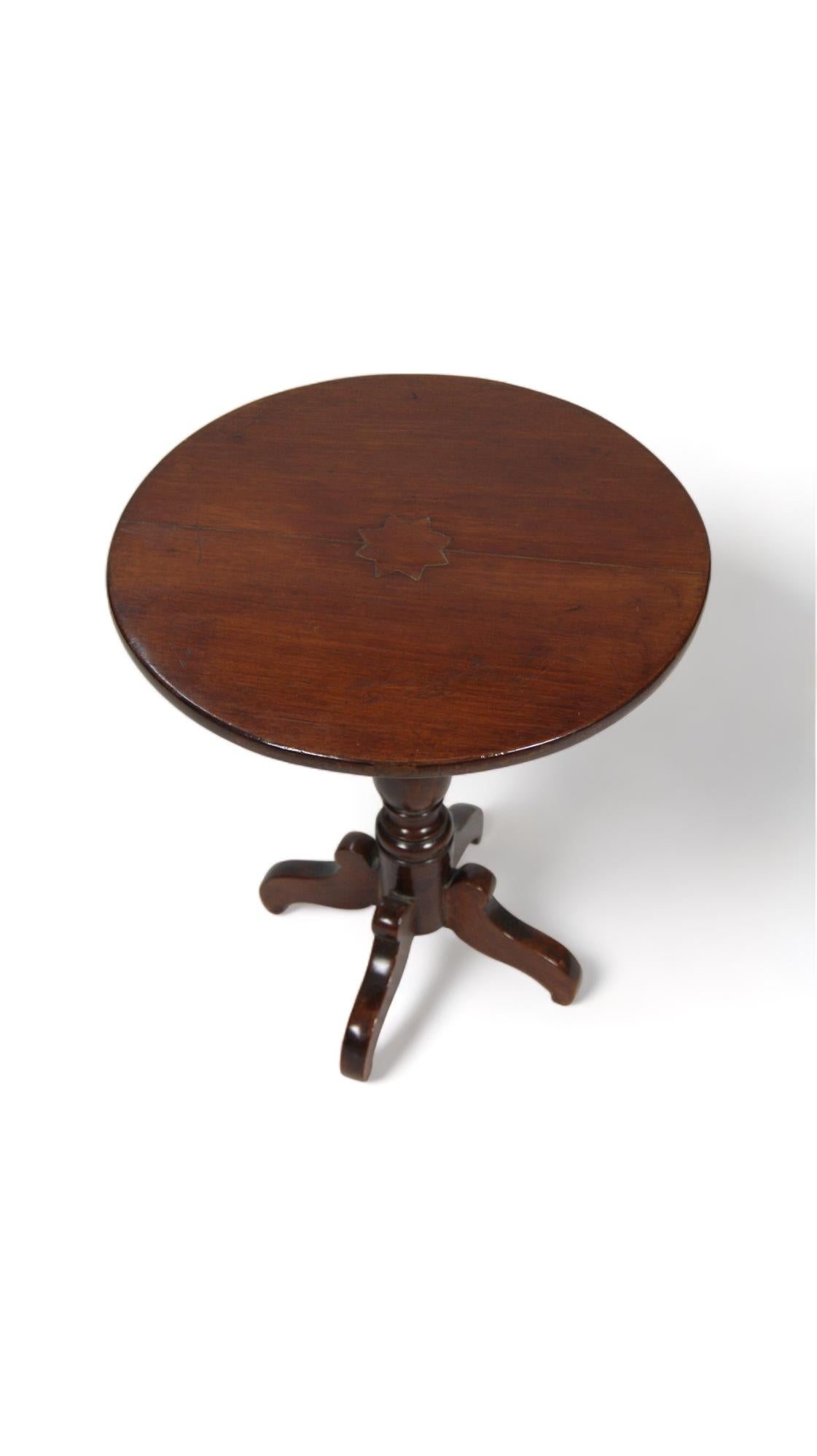 The vintage mahogany side table with tripod base is a timeless work of art that evokes the elegance and charm of bygone eras. With its exquisite craftsmanship and distinctive design, this piece stands out like a jewel in any space.

Mahogany, with