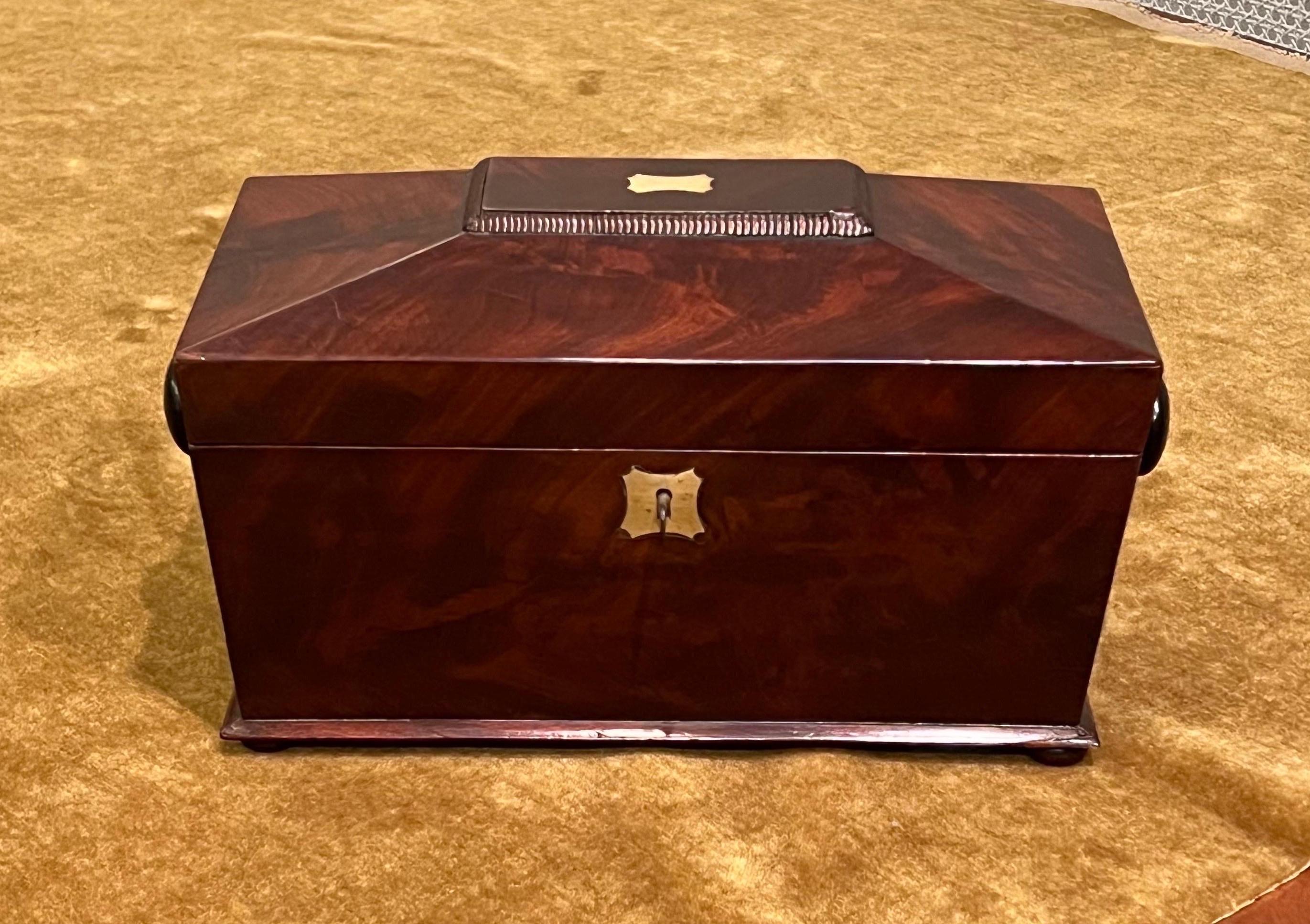 Early 19th century Sarcophagus mahogany tea caddy 
Very rare retaining it's origanal removable lidded compartments made of
cigar box mahogany, as well as its origanal Cut glass mixing bowl.
Box has been cleaned & waxed. Makes a great gift.