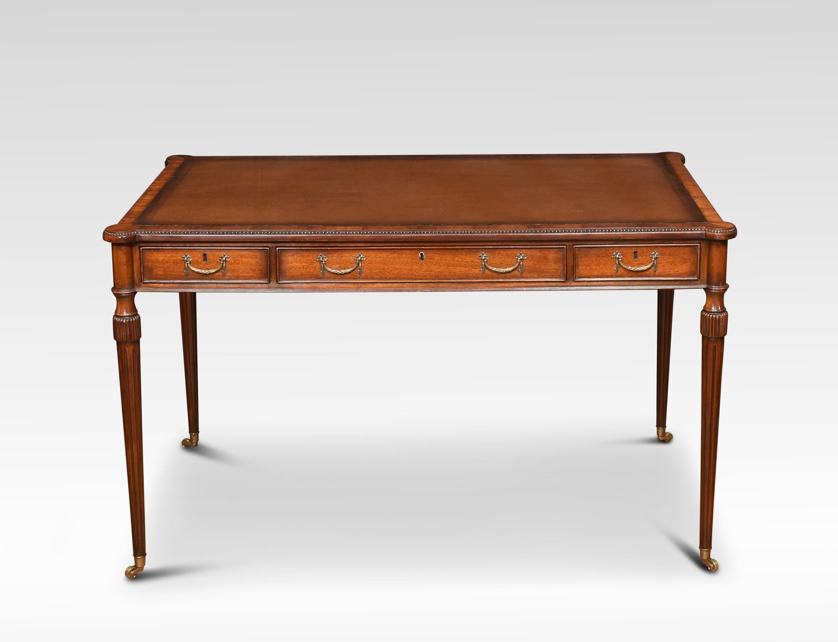 Mahogany three drawer writing table the rectangular top with inset brown tooled leather top above three drawers with brass handles. Raised up on reeded turned legs with brass casters united by shaped stretcher.
Dimensions
Height 30 inches
Width