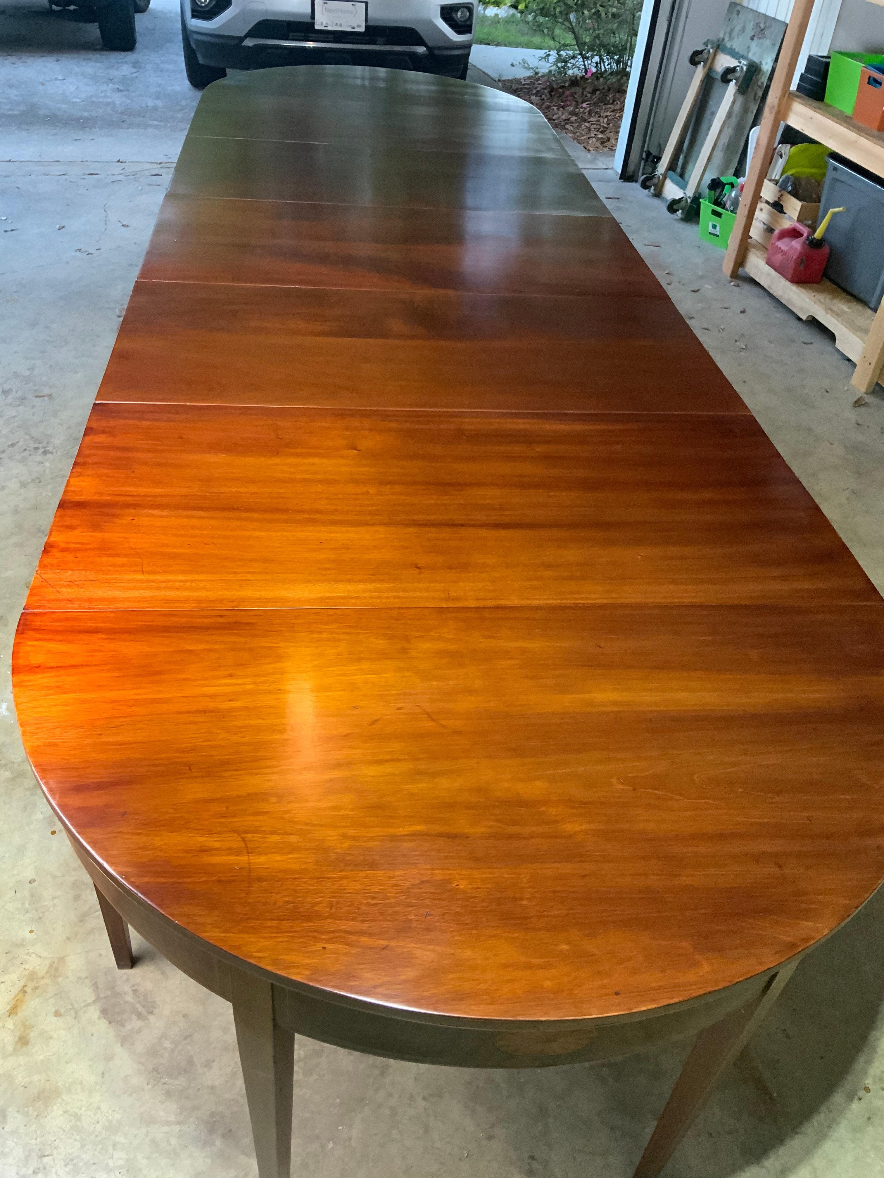 A very nice 12’5” large three section Georgian Hepplewhite style inlay Mahogany banquet dining table. This table is completely all original and was specifically built to always be a large dining table with the two demilune ends having drop leaves