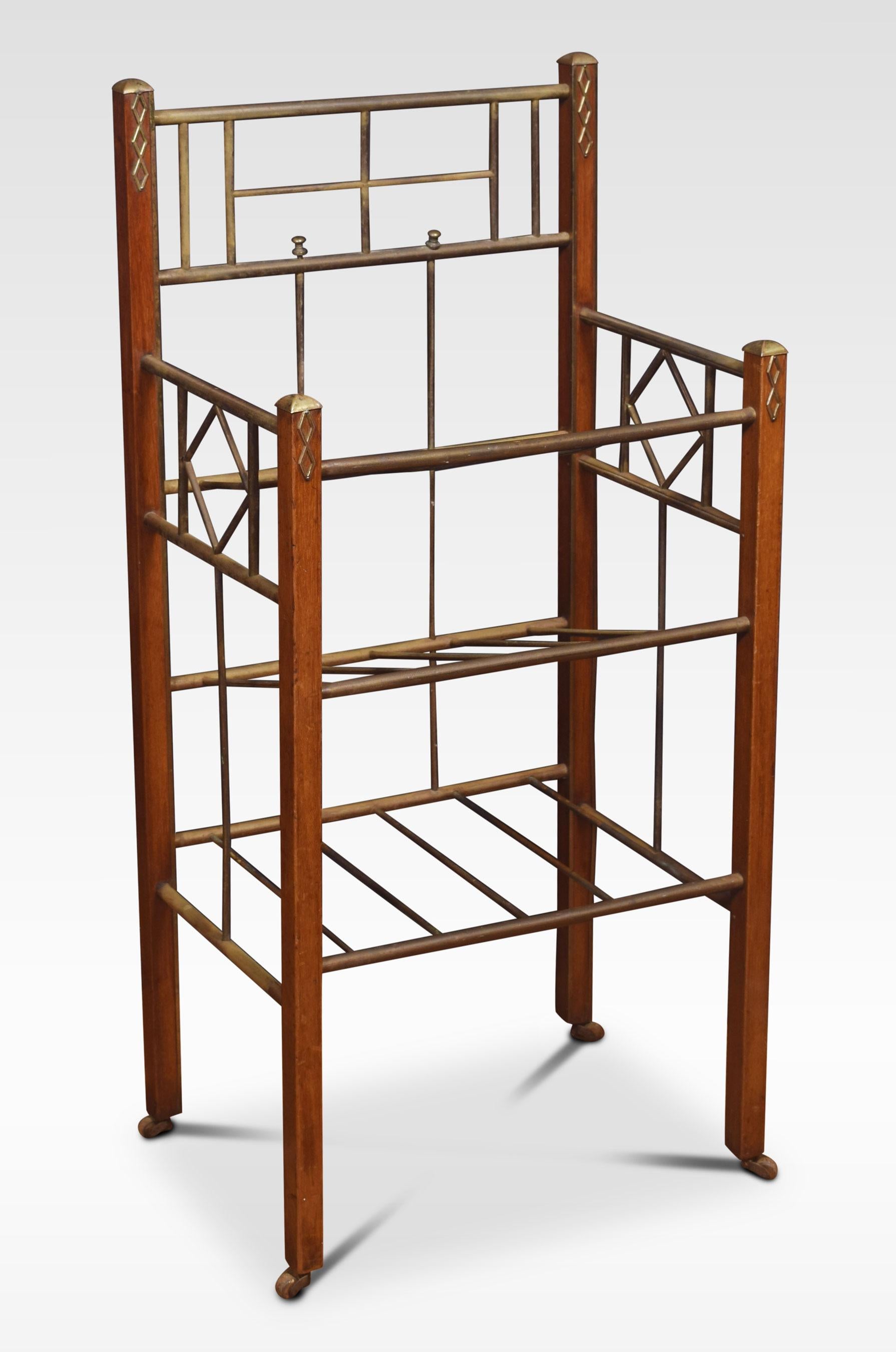 An early 20th-century newspaper stand. The mahogany frame fitted with tubular brass three-tier supports terminating in brass casters.
Dimensions
Height 36.5 Inches
Length 18 Inches
width 12 Inches