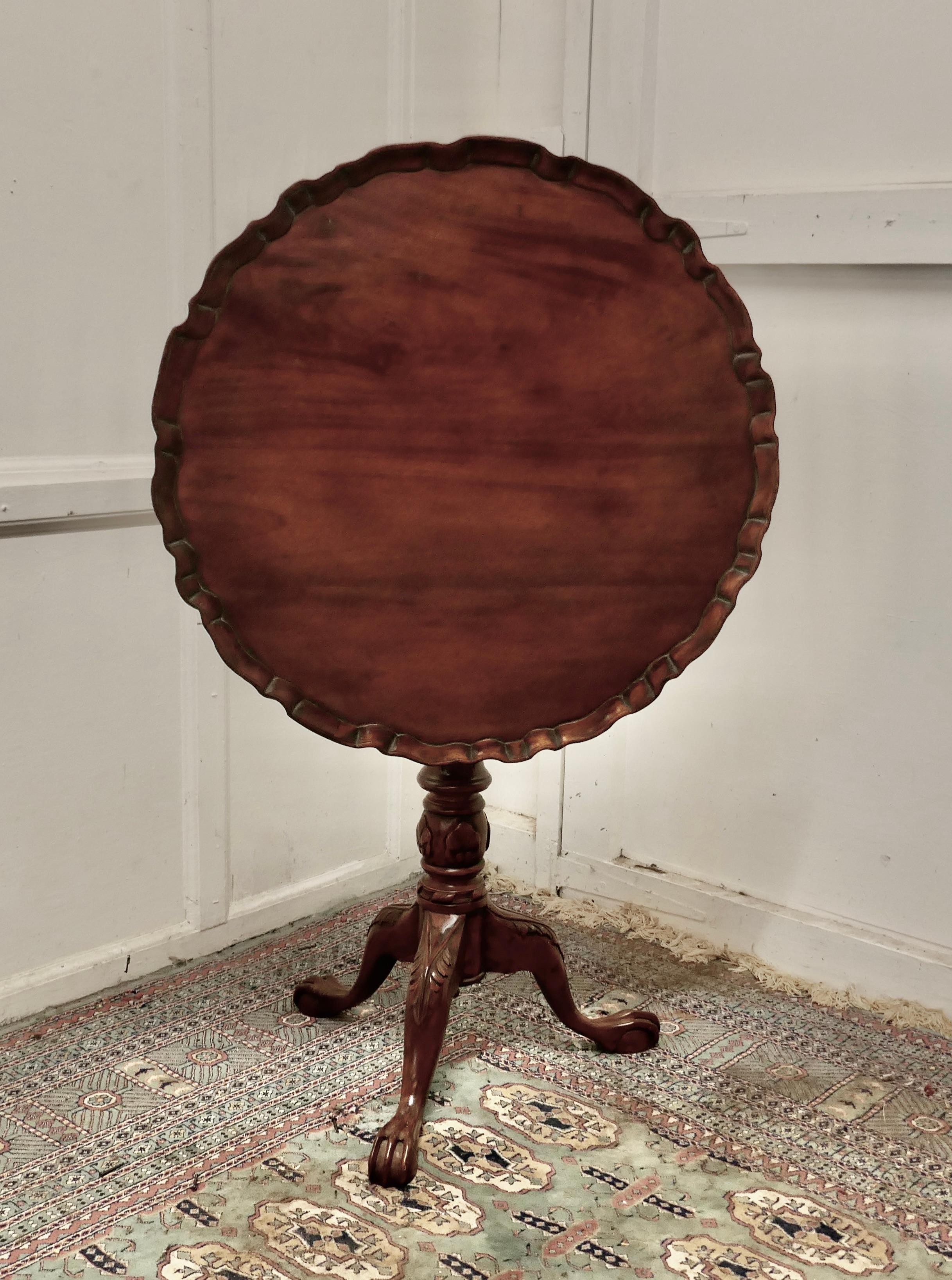 Mahogany tilt top table, bird cage wine table

This lovely table stands on a three footed ball and claw base carved with acanthus leaves at the knees and has a attractive turned centre leg, the leg supports a swivelling mechanism known as a “bird