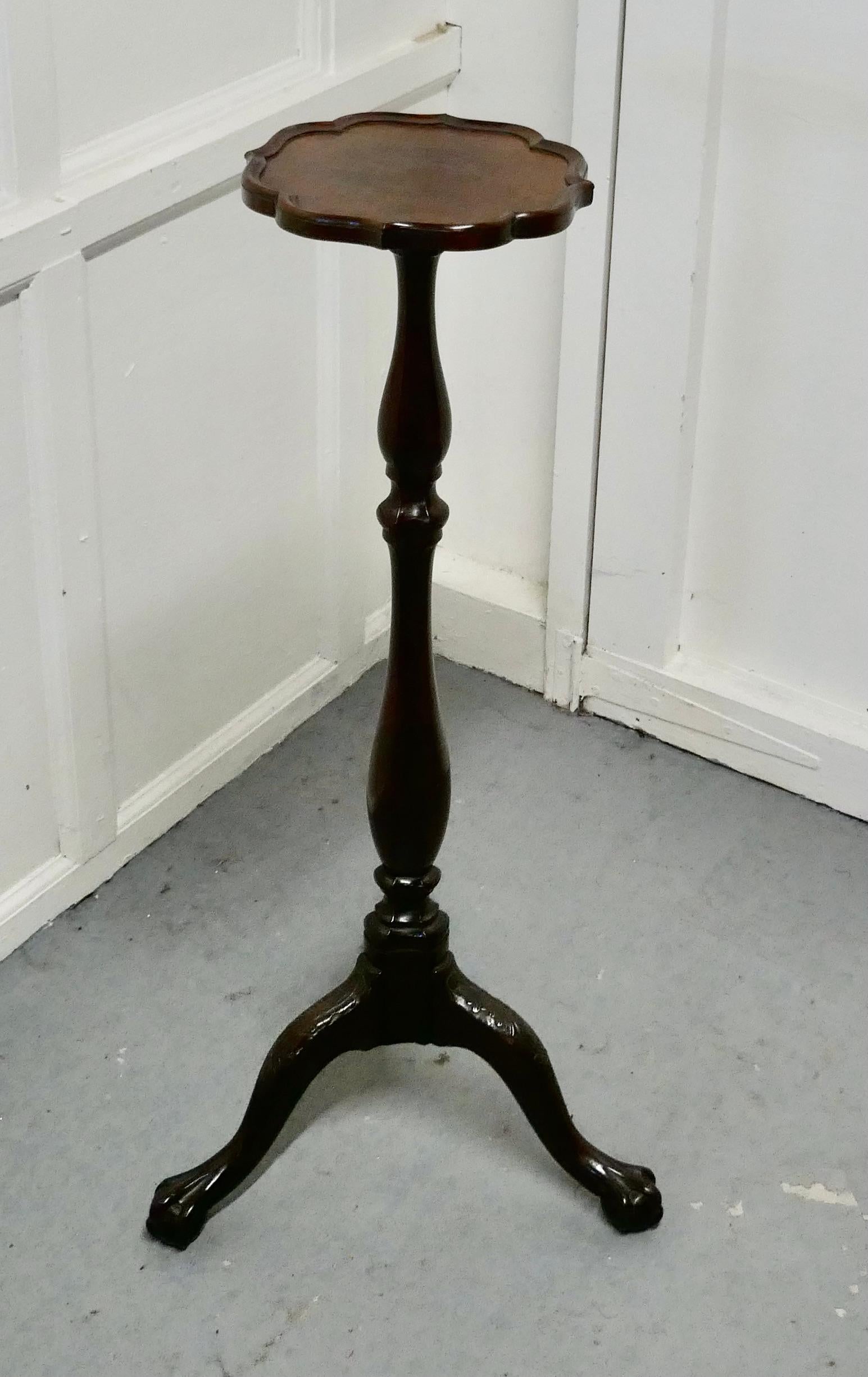 Mahogany torchere or lamp stand

This is a fine quality piece made in mahogany, the torchere has a 10”scallop shaped top with a raised moulded rim. 
It stands on a carved 3 footed base with detailed acanthus leaf carving to the feet 
The stand