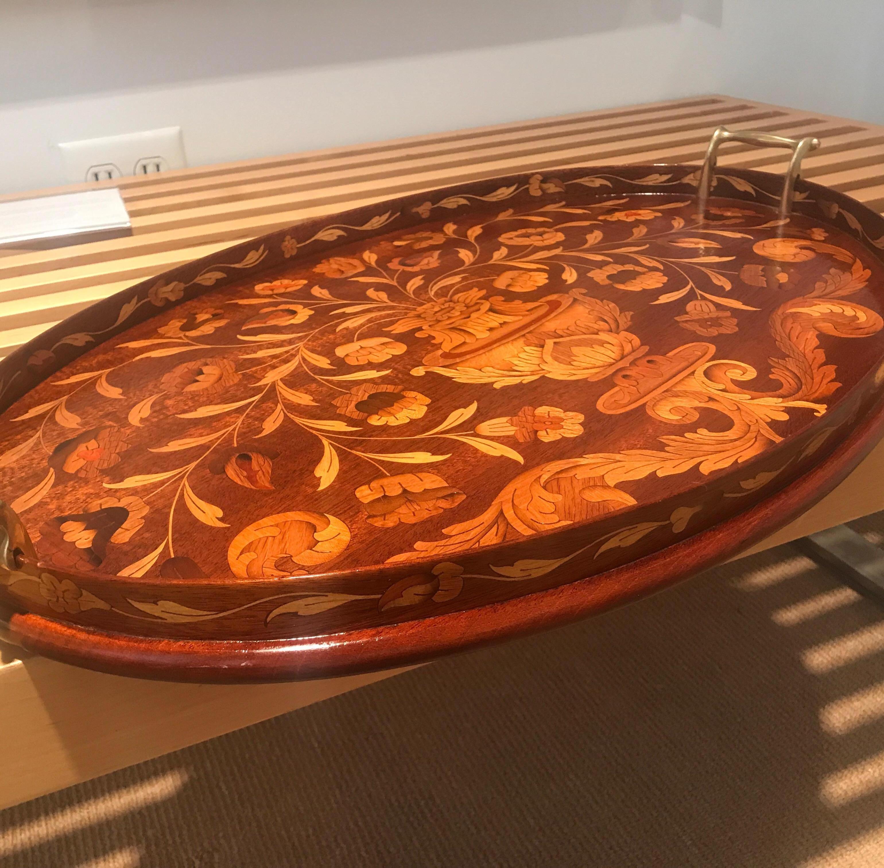 Elegant mahogany tray with elaborate inlays of tulipwood, Kingswood and satinwood. The tray with beautiful inlay all-over the surface, including on the inside and outside of the gallery edge. In excellent condition. Classic English cast brass