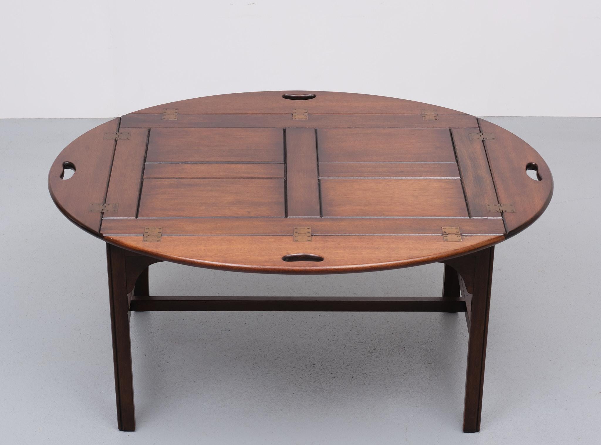 Very nice classic tray table. Tick solid mahogany tray. Fits perfect on the table. Brass hinges. Good quality table. Manufactured by Bevan Funnell England 1960s.
