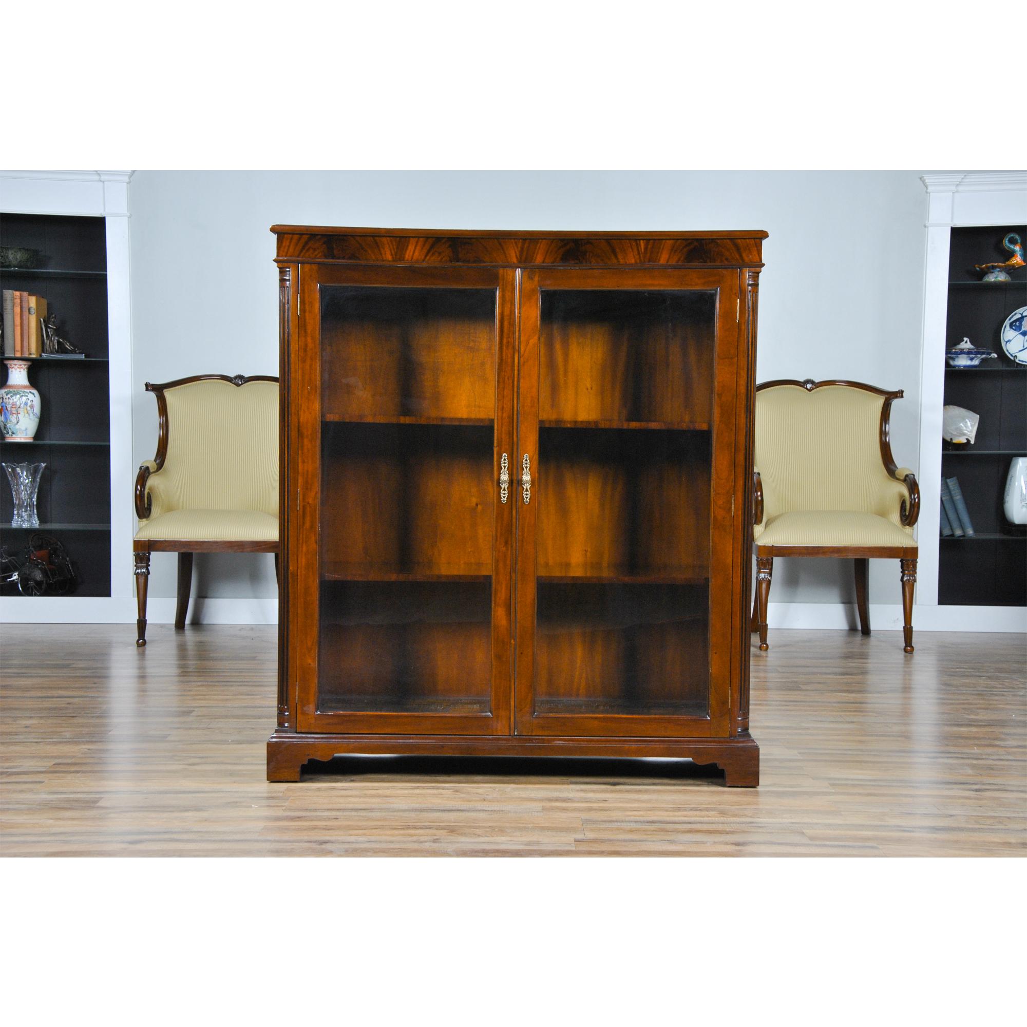 This Mahogany Two Door Bookcase from Niagara Furniture can be used to display your most valued collectables. This bookcase is a perfect size to fit in most rooms and the reeded corner columns, bracket feet match many of the other pieces of Niagara