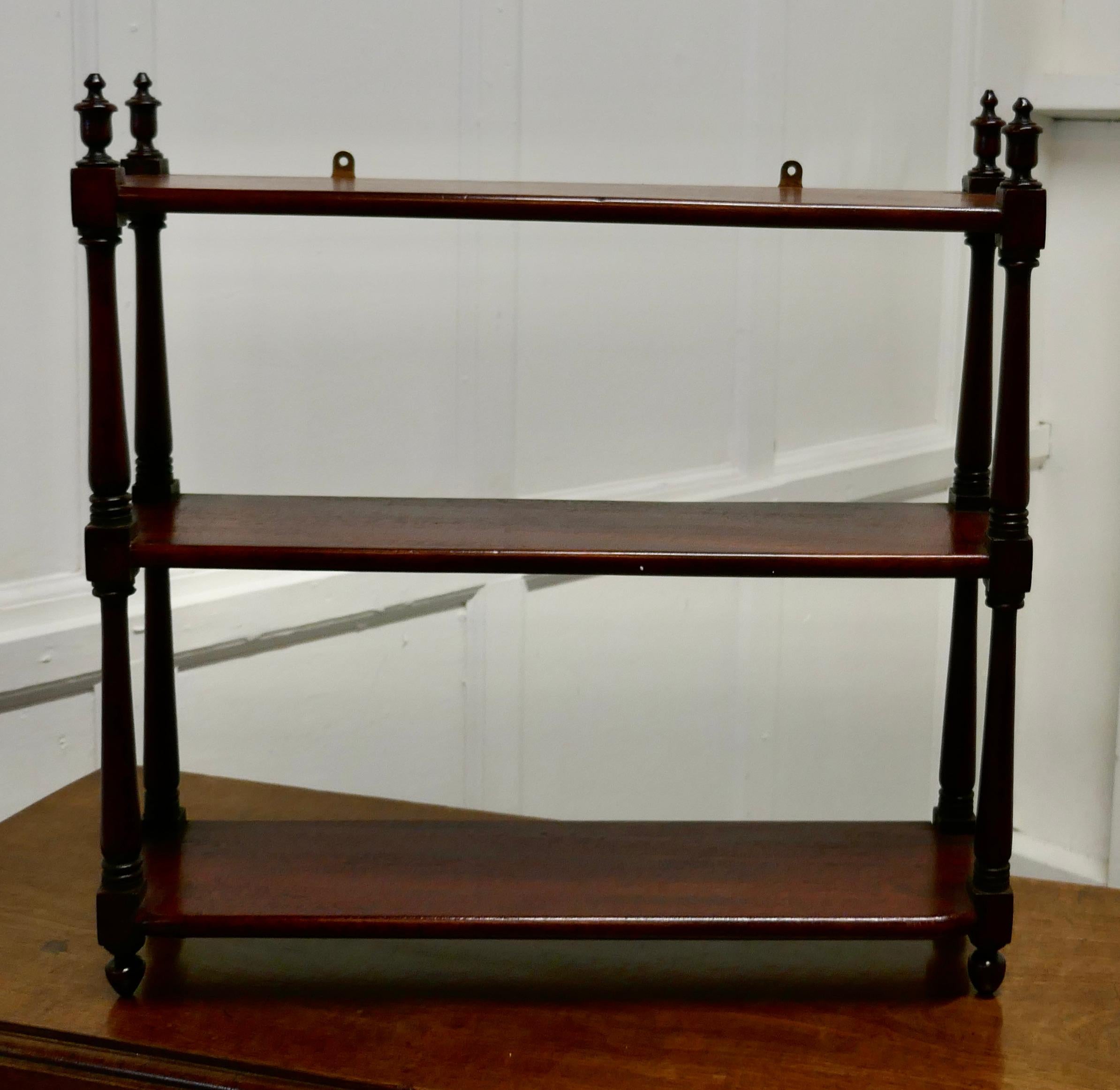 Mahogany wall hanging etagere

This charming little shelf unit, has 3 shelves, turned finials and feet
The shelf is in good condition and would work well in the Bathroom Kitchen or Bedroom 
The Shelf is 5.5” deep, 20” long and 20” high
TGB608.
